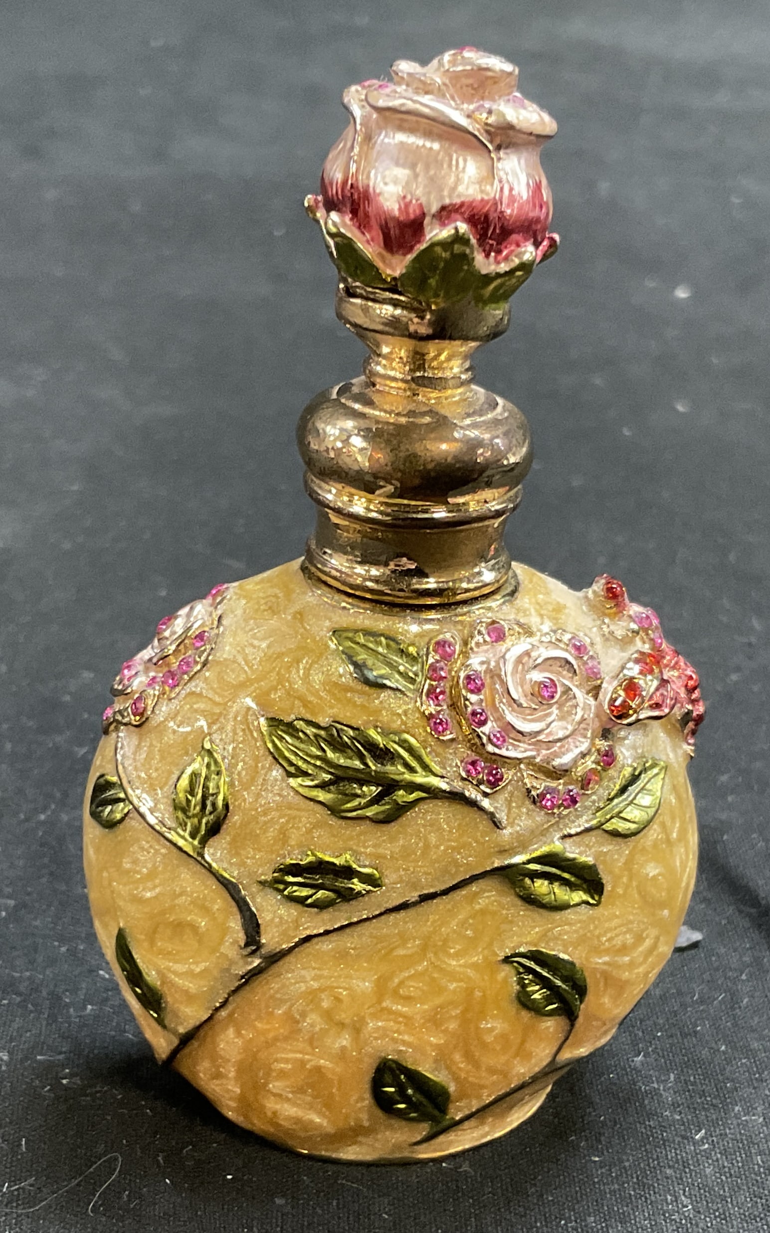 Jeweled Enamel Perfume Bottle: Swirled Enamel Jeweled Perfume Bottle With Rose and Bumblebee Motifs. Gilt Metal Body. Condition Consistent With Exposure. Measures app 3.25in H x 1in Base. Perfume Bottles, Jeweled, Rhinestones,