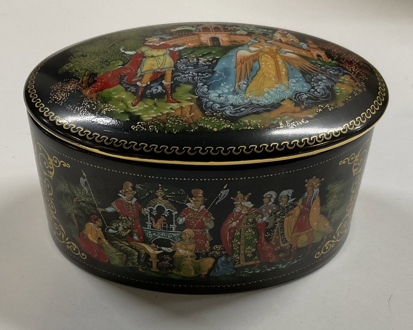 1989 SGND V. Vlezko Palekh Porc Trinket Box USSR: 1989 Signed Vladimir Vlezko The Tale of Tsar Saltan Palekh Porcelain Trinket Box. Made in USSR. Condition Consistent With Exposure. Measures app 2.5in H x 4in Diam. Vintage Trinket Box, Signed Trinket