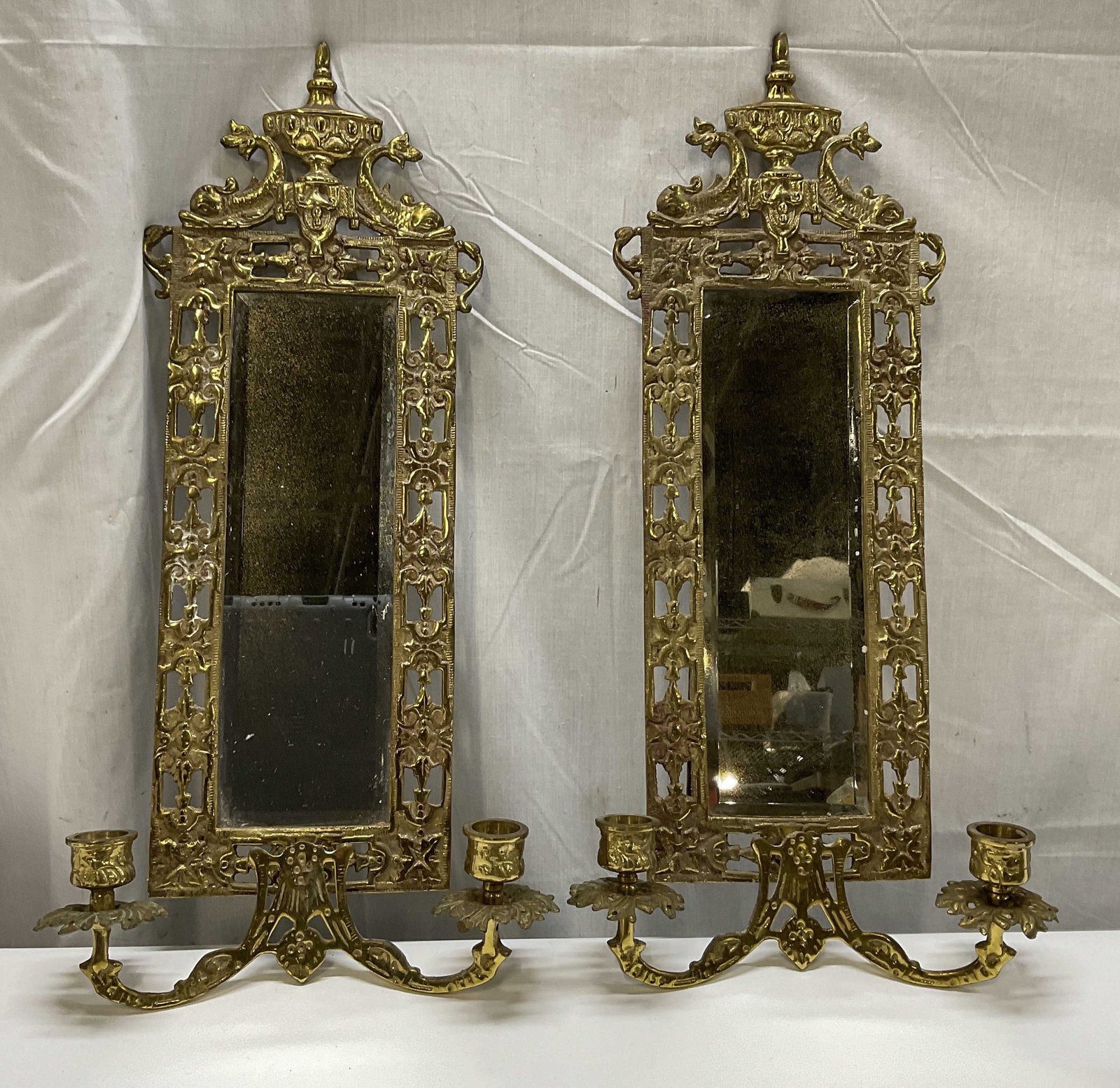 Lt2 ATQ Renaiss Rev Brass Mirrored Wall Sconces: 2 Antique Renaissance Revival Brass Mirrored Wall Sconces. Koi Fish and Urn Motifs. Foxing and Aging to Metal Present. Measures app 19.5in H x 9.5in W. Antique Wall Sconces, Mirrors, Candles, Renaissa