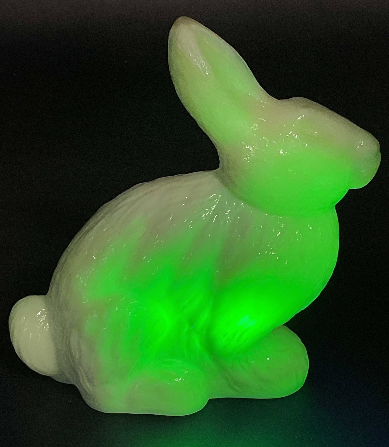 Mosser Uranium Jadeite Glass Rabbit Figurine: Vintage Mosser Glass uranium jadeite glass sitting bunny rabbit figurine. Glass fluoresces under UV light. Measures approx. 4.75 x 2 x 5 inches. Some scratching. Mosser glass, uranium glass figurine, 