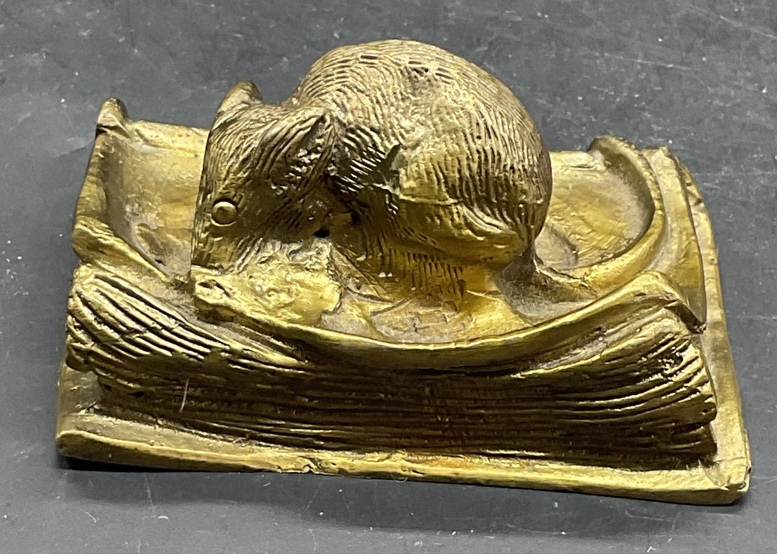 Vintage Brass Mouse on Book Figurine: Vintage cast brass mouse on book figurine. Measures approx. 3 x 1.75 x 1.5 inches. Some scratching and patina. Mouse figurine, brass mouse, collectibles, home decor, table decor, 10 s