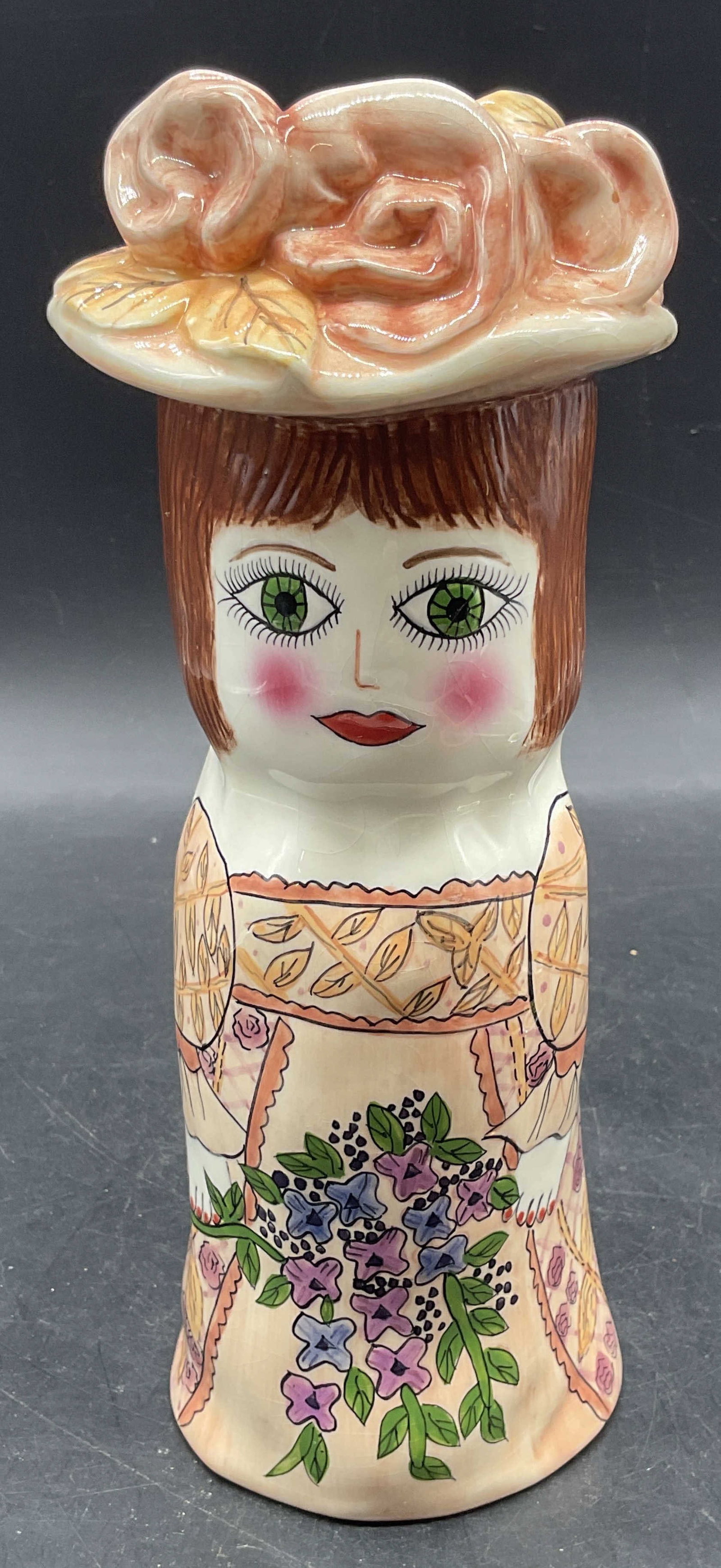 Susan Paley GANZ Ceramic Figural Maria Vase: Vintage GANZ ceramic figural vase designed by Susan Paley. Maria. Woman with flowers in pink. Hand painted. Measures approx. 4 x 9.25 inches. Some scratching and crazing. GANZ vase, Susan paley vase, 