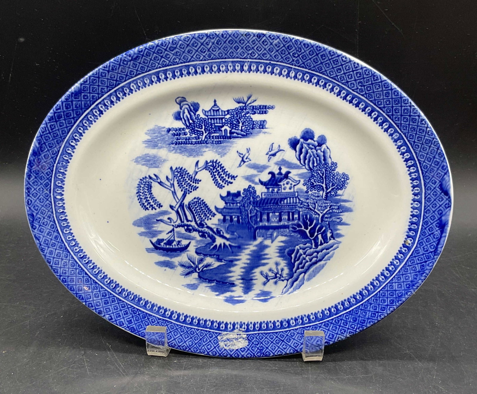 Vtg Libertas Ceramic Blue Willow Platter England: Vintage Libertas ceramic platter. Blue Willow transfer print pattern. Made in England. Measures approx. 10.75 x 8.25 inches. Some scratching. Blue willow platter, blue and white platter, vintage platt