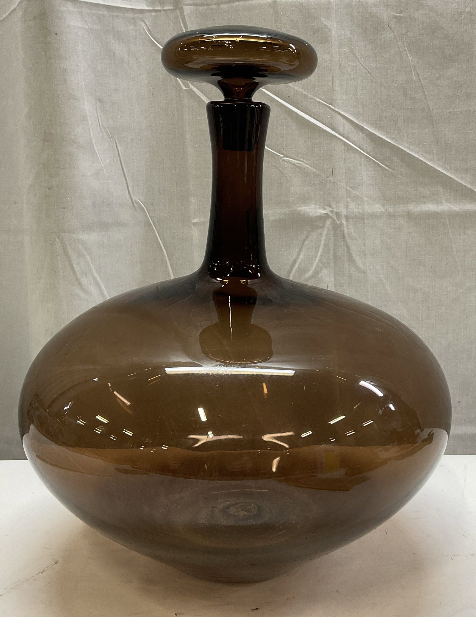 VTG 15in Glass Decanter w/ Mushroom Shp Stopper: Vintage Brown Glass Decanter With Mushroom Shaped Stopper. Scratching Present. Measures app 15in H x 11.5in Diam. Vintage, Glass Decanter, Brown Glass, Chestnut Brown, Mushroom Shaped, Art Glass, Bar 