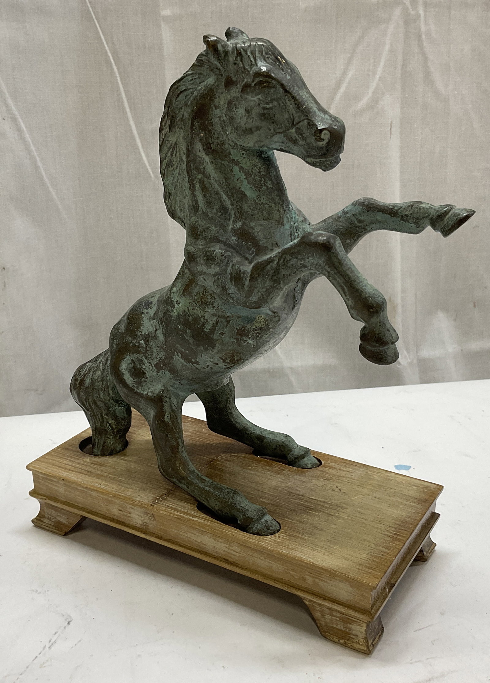 VTG Patinated Bronze Rearing Horse Statue: Vintage Patinated Bronze Rearing Horse Statue on Wooden Stand. Condition Consistent With Exposure. Measures app 8in H x 6in L. Vintage, Patinated Bronze, Bronze, Rearing Horse, Horses, Horse Sculpture
