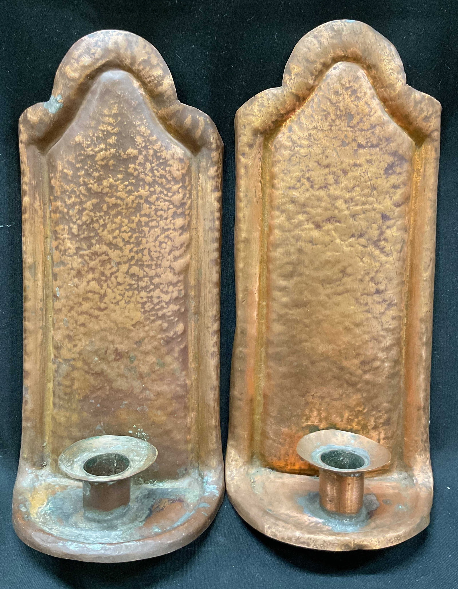 Pair Vintage Copper Wall Candle Holders: Pair of vintage copper wall candle holders. Arched top and bottom. Hammered copper design. Rectangular shape. Candle cups on bottom. Measures approx 4.5 x 10 inches. Surface wear consistent with expos
