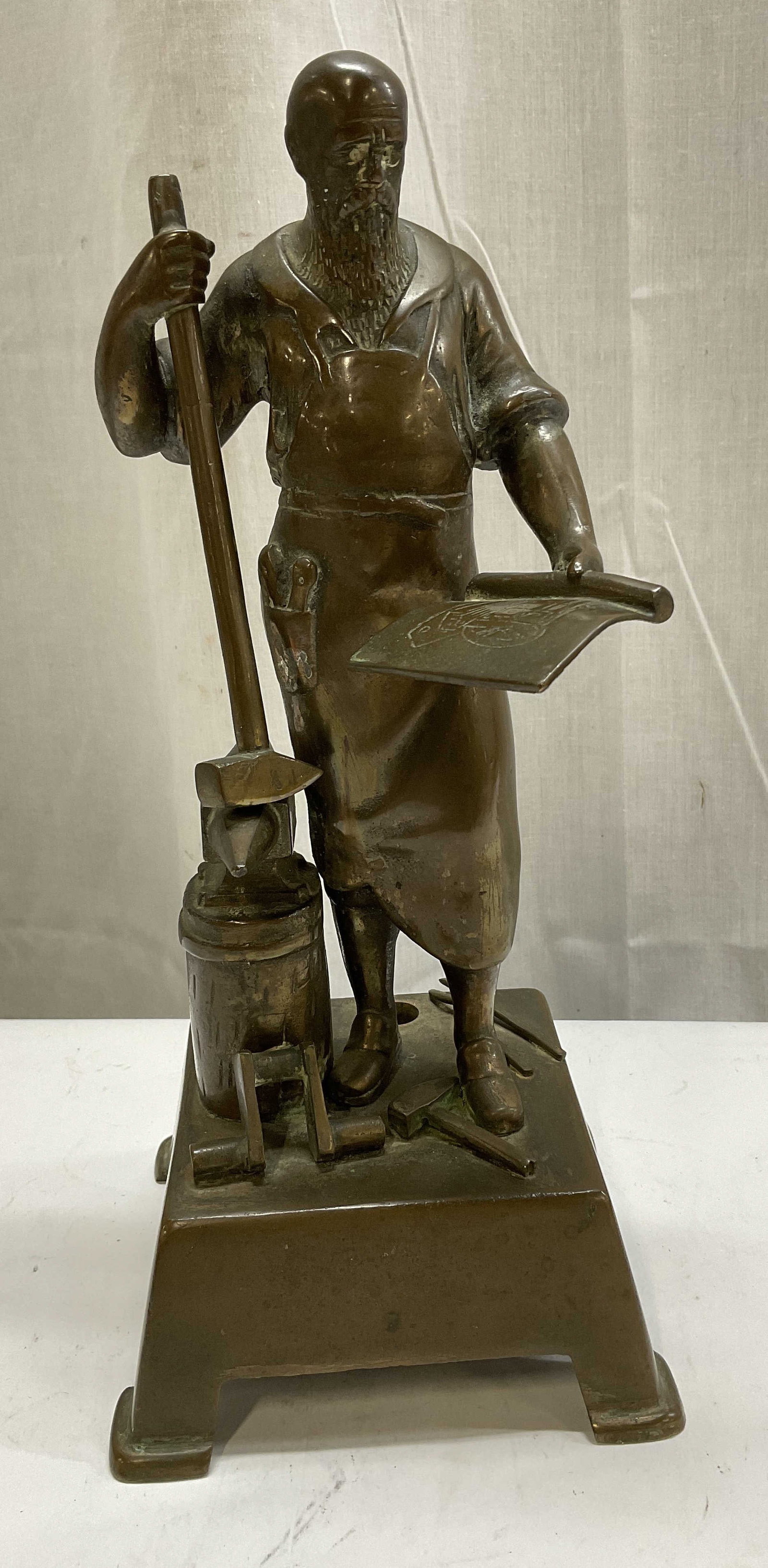 Otto Rasmussen Bronze Blacksmith Sculpt GERMANY: Antique Otto Rasmussen Patinated Bronze Schmied am Amboss (Blacksmith at the Anvil) Sculpture. Made in Germany. No Visible Signature. Aging to Metal Present. Measures app 10.5in H x 4.5in W.