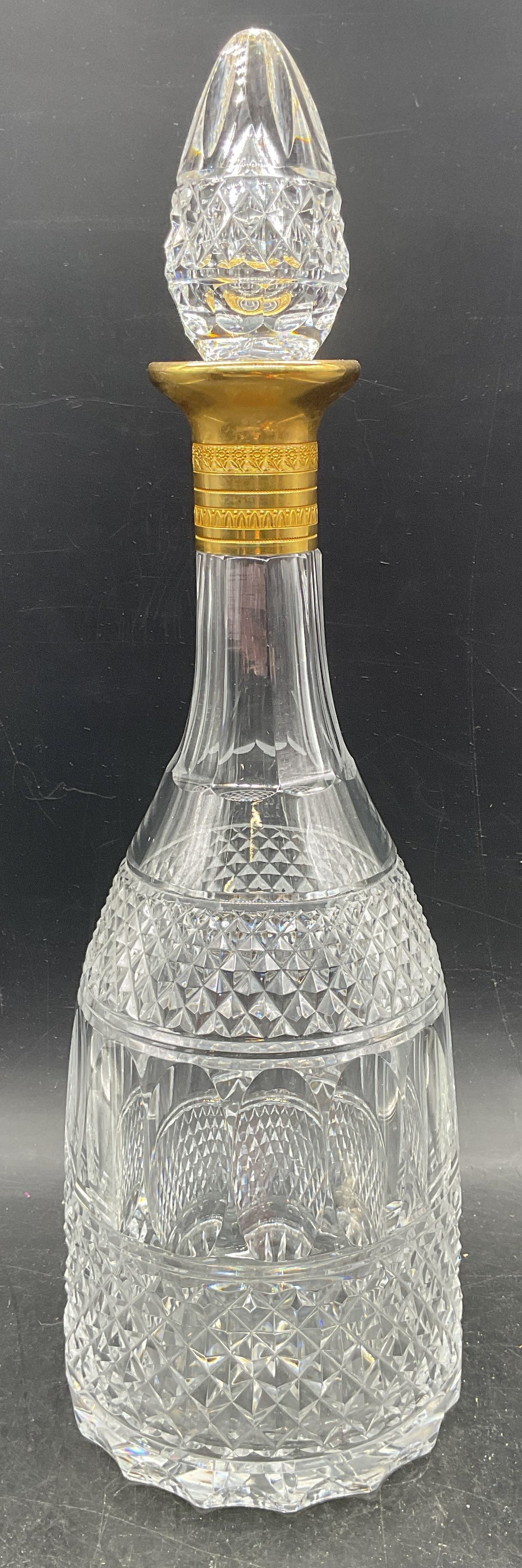 Vintage Cut Crystal Gold Plated Decanter: Vintage cut crystal decanter with diamond and oval paneled pattern and gold plated rim. Measures approx. 5 x 13 inches. Thick walled crystal, piece has weight. Some wear including scratches, patina, s