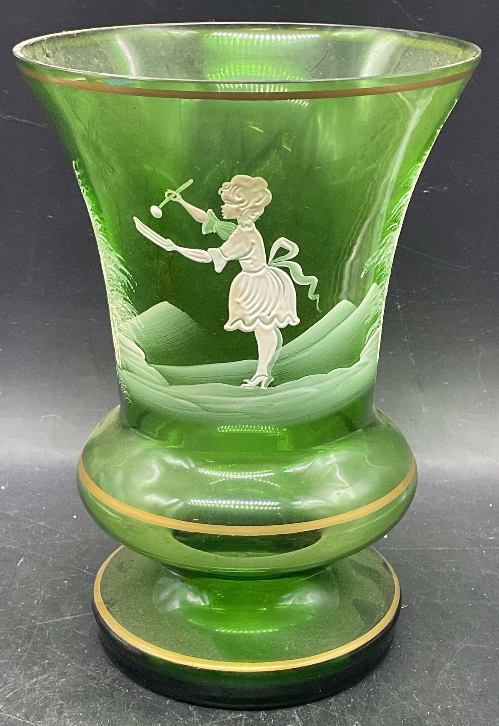 Antique Mary Gregory Green Enamel Glass Vase: Antique Mary Gregory emerald green art glass vase. Hand painted enamel with child motif and gilt decoration. Measures approx. 5.75 x 8.25 inches. Some scratching. Mary Gregory vase, art glass vase, an