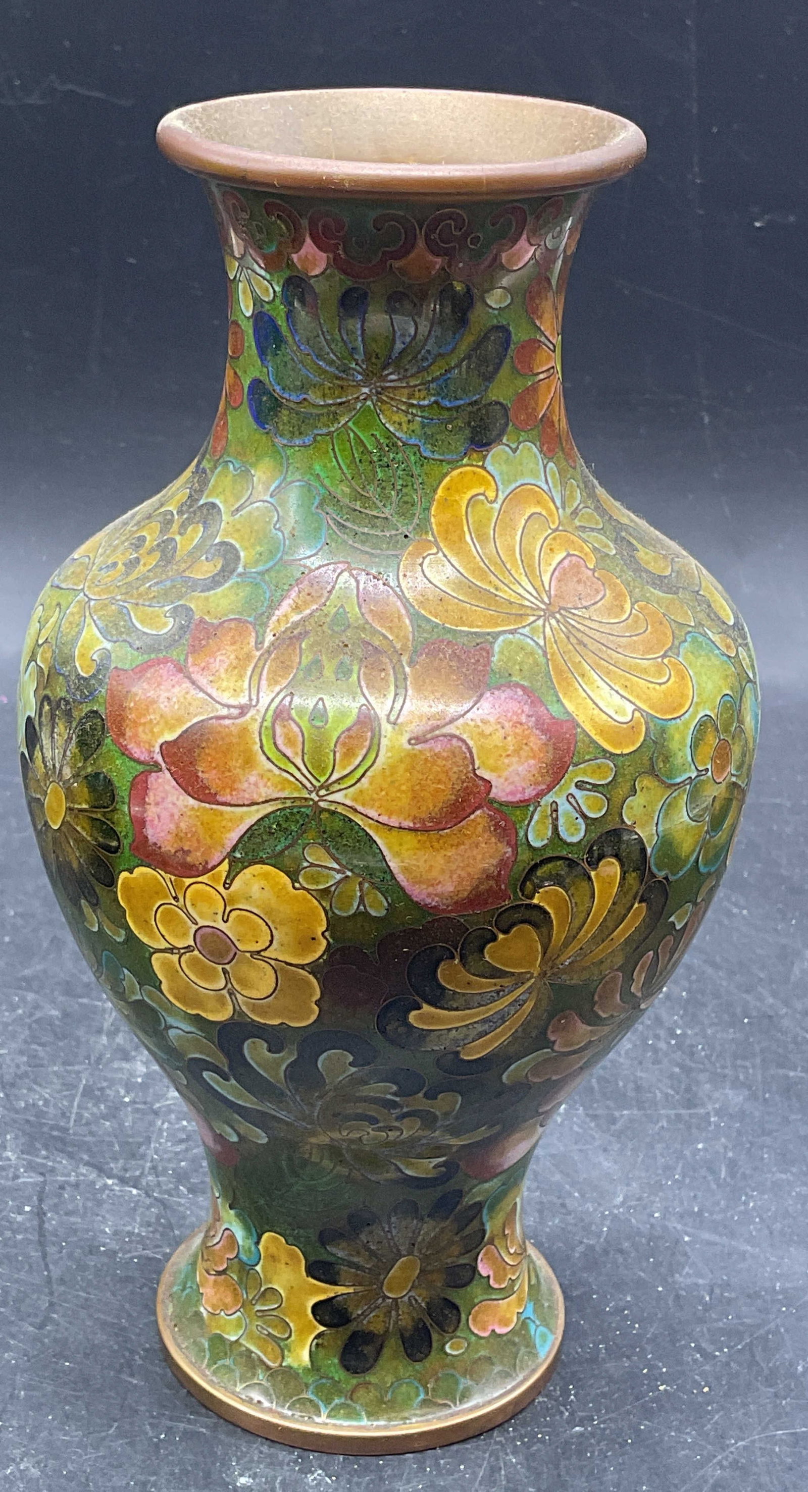 Vintage Asian Floral Cloisonne Copper Vase: Vintage Asian cloisonne enameled copper vase with floral motif in green. Measures approx. 4 x 7.75 inches. Some scratching and patina. Cloisonne vase, enamel vase, copper vase, Asian vase, collectible