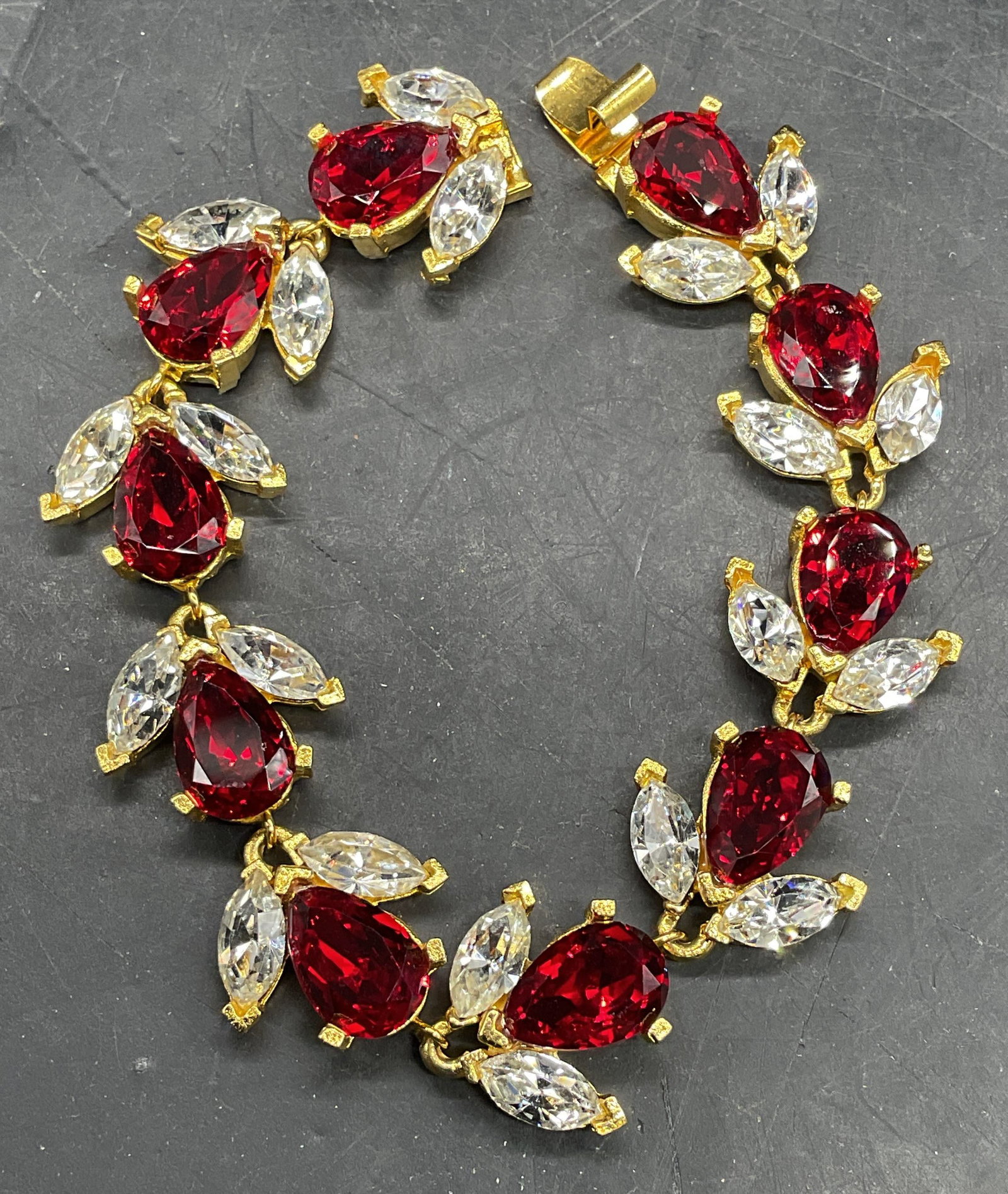 Vintage Gold Tone Red Crystal Bracelet: Vintage gold tone red and colorless crystal bracelet. Measures approx. 7.5 inches long. Some scratching. Jewelry, estate jewelry, costume jewelry, cocktail jewelry, fashion jewelry, accessories, fashi