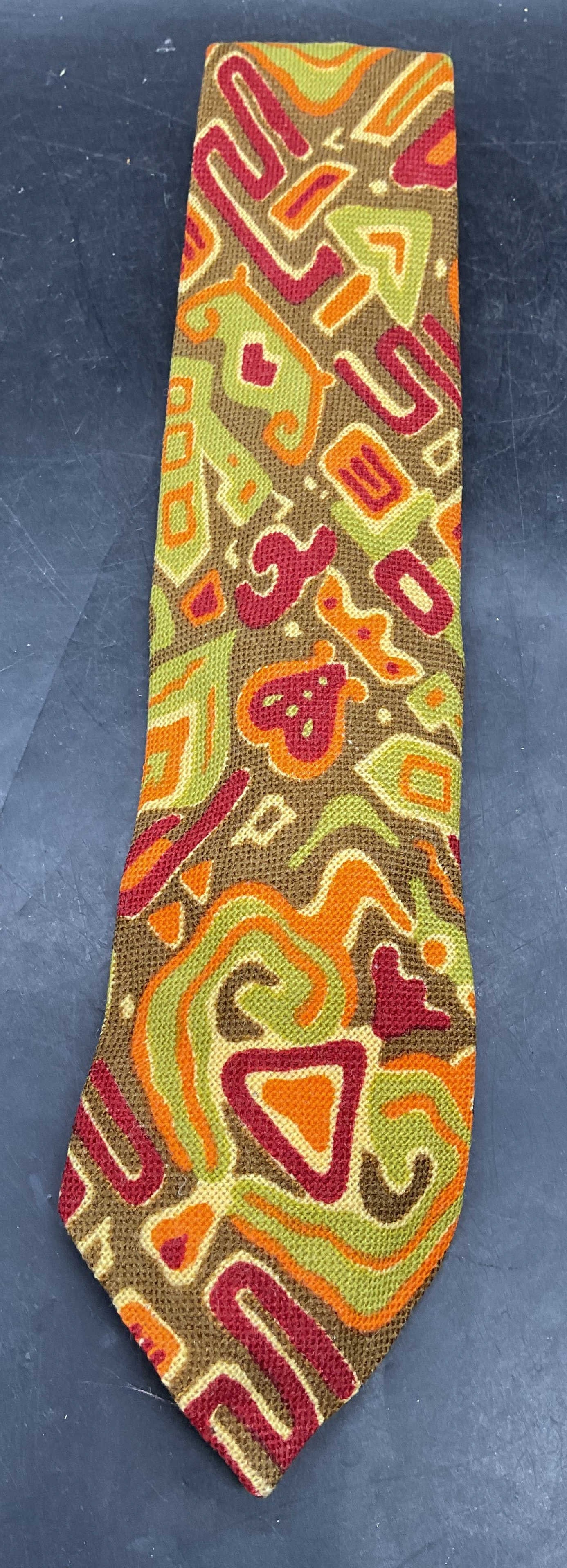 Vtg William Edward King Wool Tie Scotland: Vintage William Edward King green, orange, red abstract print Shetland wool tie. GIMBELS label. Loomed in Scotland. Measures approx. 56 inches. Some blemishes. William Edward king tie, designer tie,