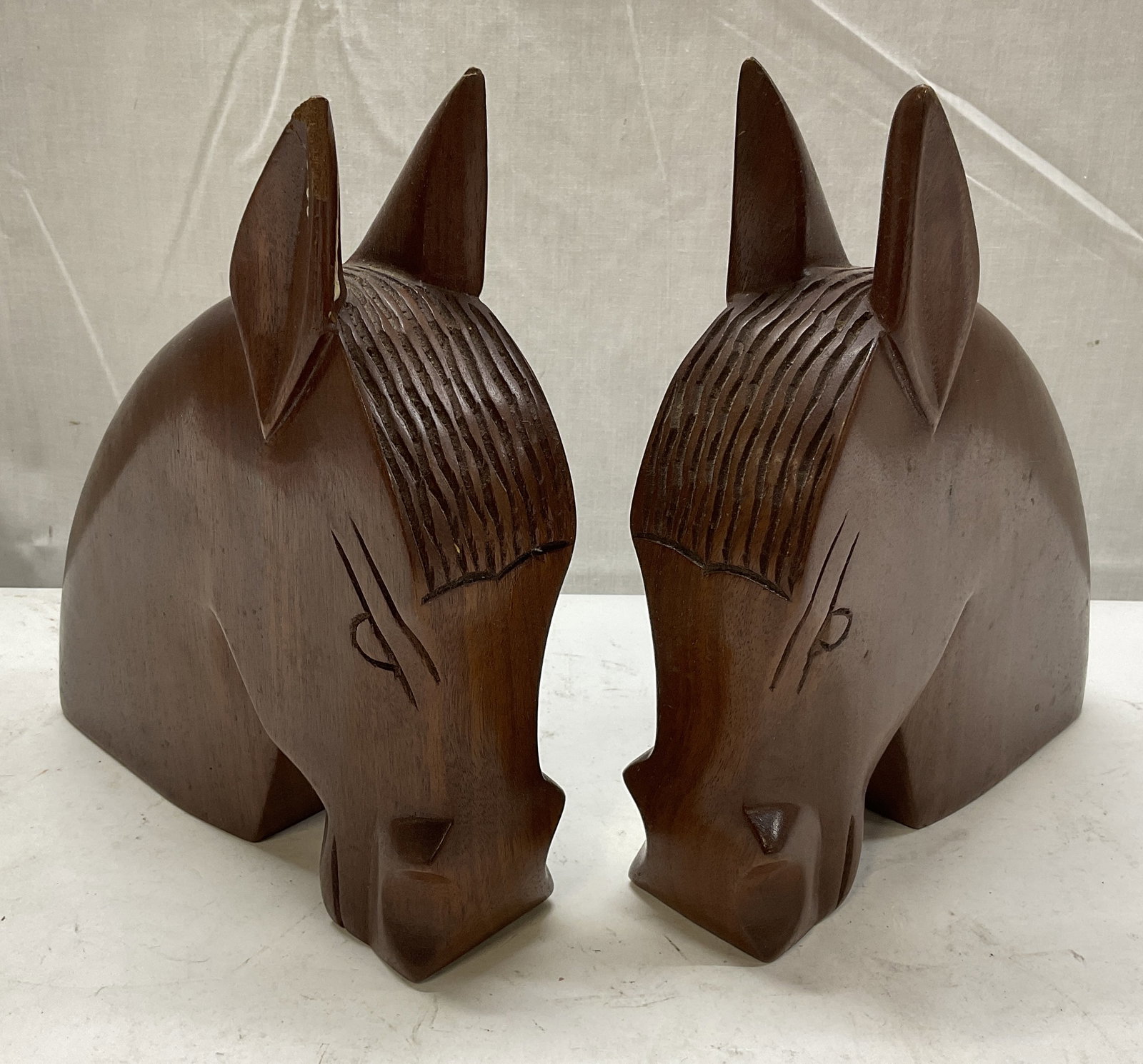 VTG Hand-Carved Mahogany Horse Bookends: Vintage Hand-Carved Mahogany Horse Bookends. Scratching and Chips Present. Measures app 8.25in H x 7.25in L. Vintage, Carved Wood, Mahogany, Bookends, Horses, Equestrian Decor, Animal Decor,