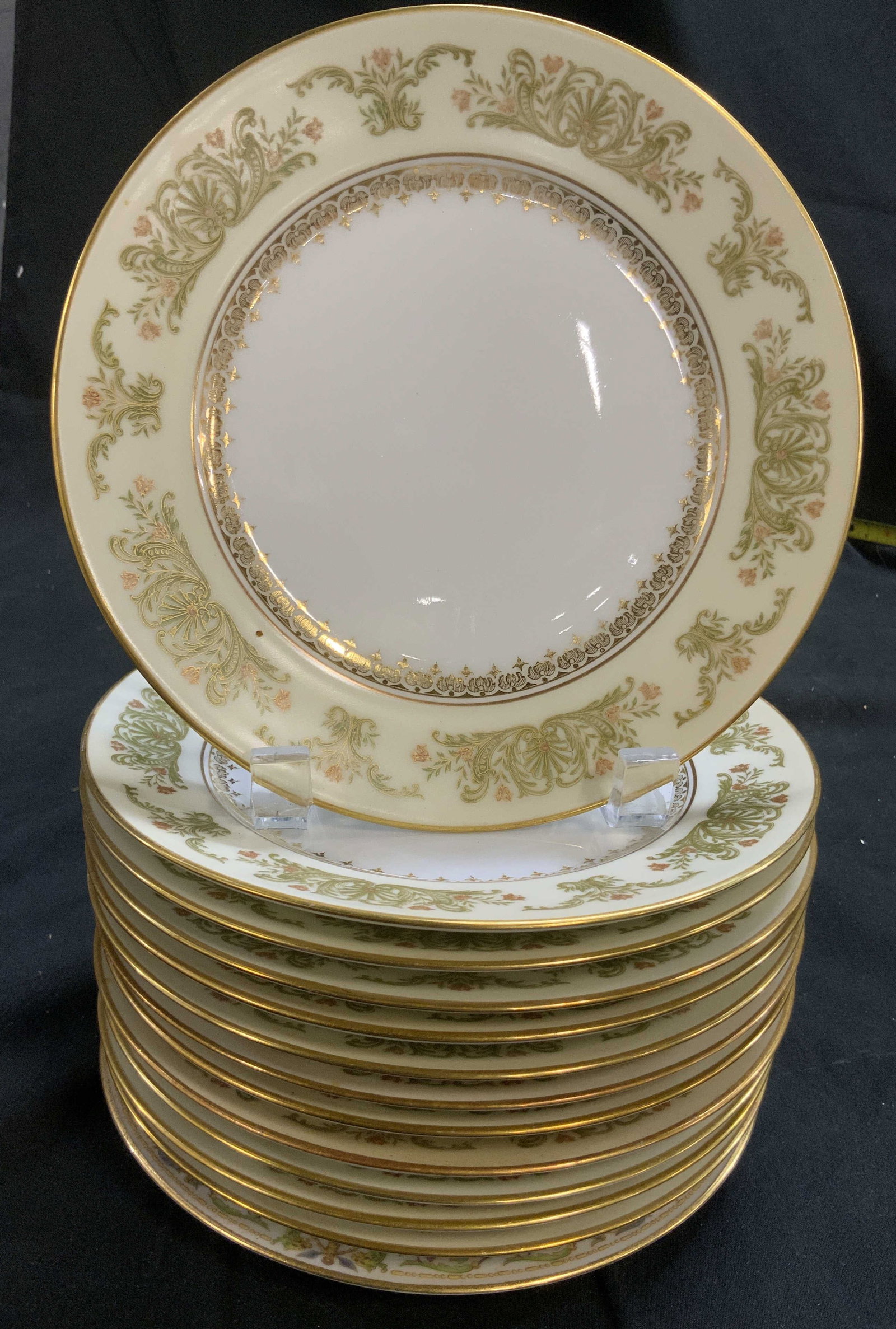 Set 13 French Limoges porcelain Plates: Underside reads France Depise with an intricate trademark symbol, underneath is painted C. Abrenfeld Limoges, Wright Tyndale and Van Rosen, Philadelphia, fine china plates featuring a complex scroll
