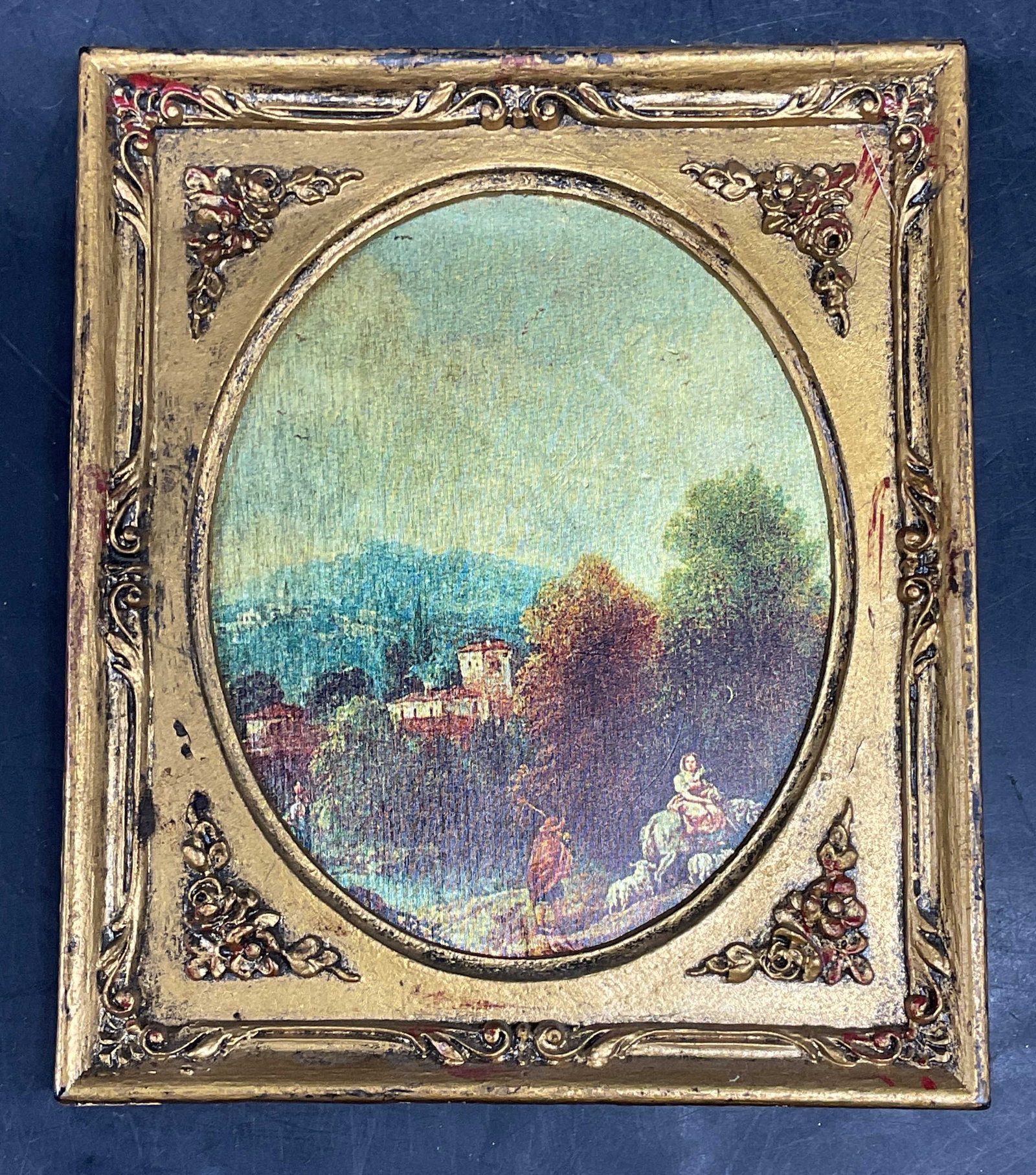 Framed Pastoral Scene Print on Fabric, Italy: Framed print on fabric. Pastoral scene with landscape and figures. Ornate gilt composite frame, marked Italy. Not examined out of frame. Frame measures approx. 5.25 x 4.5 inches. Wear including