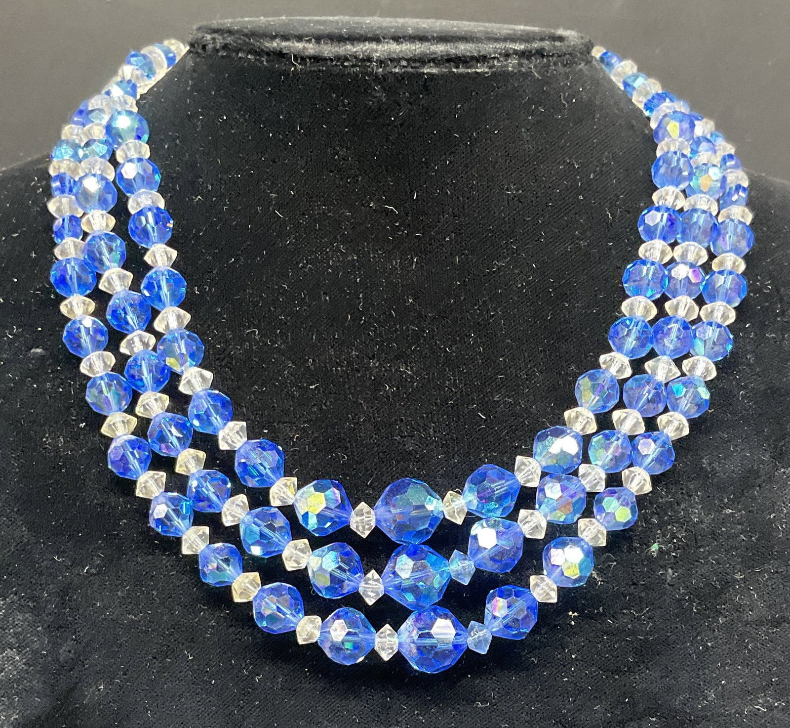 Vintage Blue Crystal 3 Strand Necklace: Vintage blue and colorless crystal beaded 3 strand necklace. Drop length 5.5 inches. Some scratching. Jewelry, estate jewelry, costume jewelry, cocktail jewelry, fashion jewelry, accessories, fashion