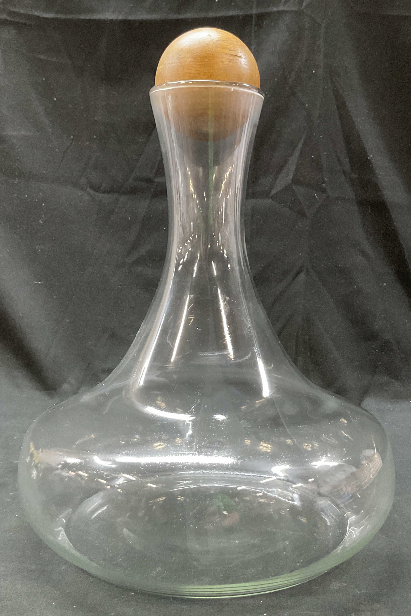 Vintage Glass Wide Base Decanter W Wooden Stopper: Vintage glass wide base decanter. Comes with wooden spherical stopper. Wide base and narrow neck. Measures ht approx 12.5 inches diam approx 11 inches. Some scratching. Decanter, tableware, home