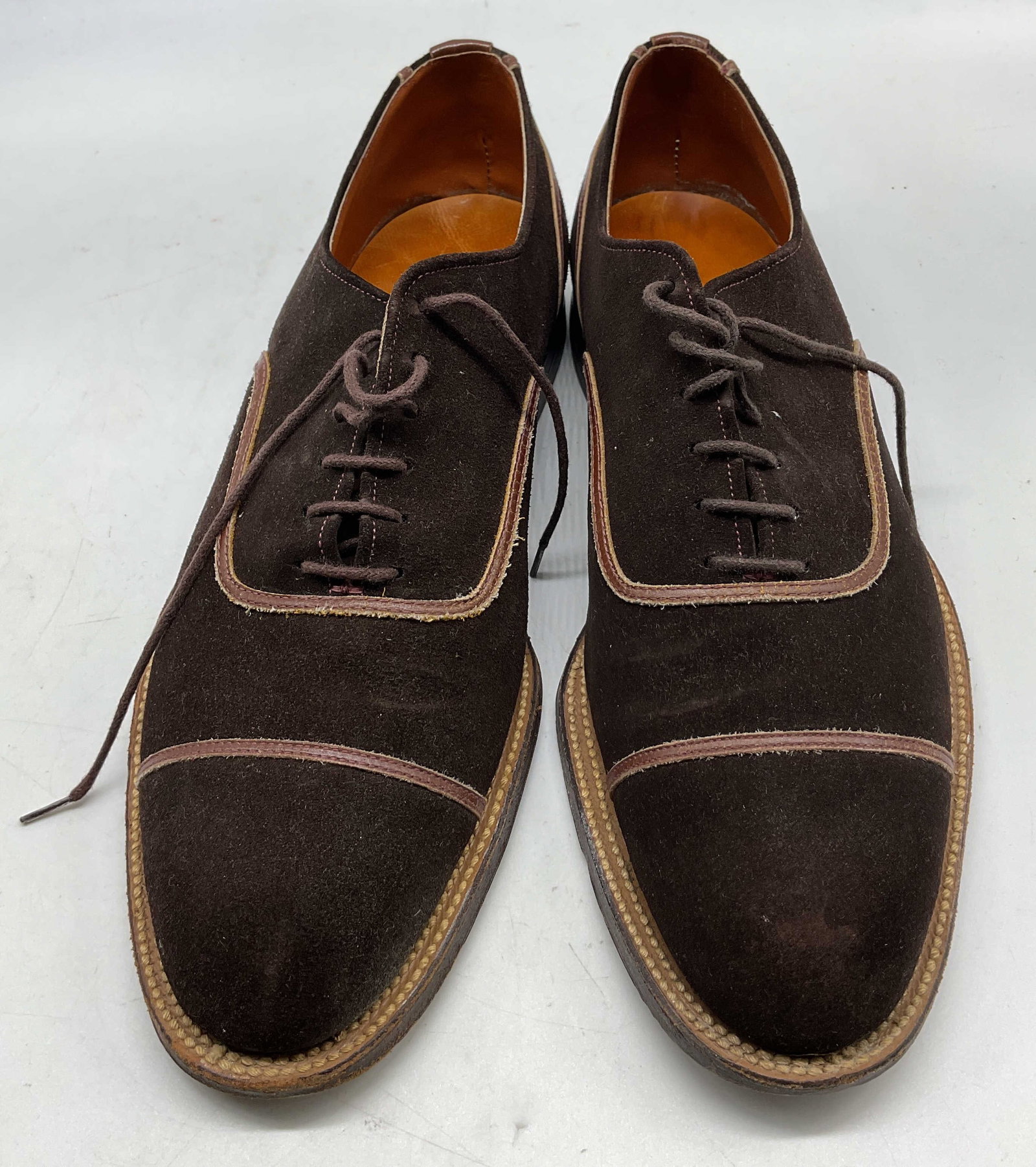 B.F. Goodrich Brown Leather & Suede Shoes: B.F. Goodrich brown leather and suede lace up shoes. Heeled shoe. Laces and unique design. 100% leather sole. Suede exterior. Measures approx 13 inches in length. Size not visible. Wear consistent wit
