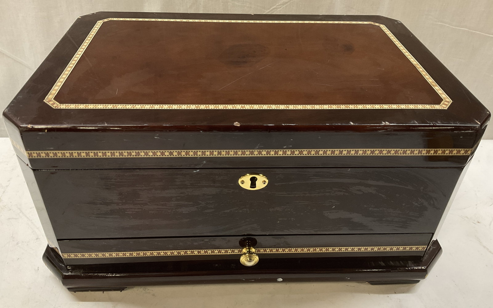Marquetry Wood Inlay Jewelry Box: Marquetry Wood Inlay Jewelry Box. Light Geometric Border on Dark Wood. Top and Bottom Drawer Open to Reveal Tan Velvet Trays and Organizers. Contains Locking Mechanism. No Key Included. Scratching