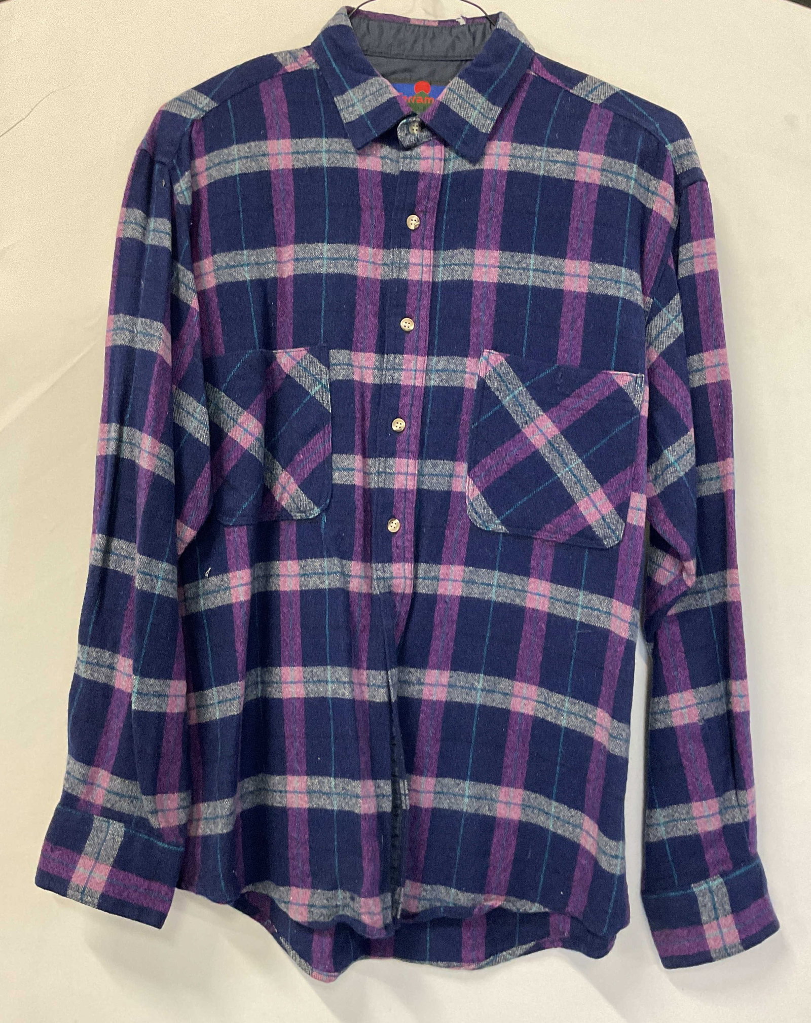 Terramar Sports Plaid Wool Button Down Korea: Terramar Sports plaid wool button down. Made in Korea. Size L. 85% wool 15% nylon. Collared and buttoned. Front pockets. Long sleeve. Plaid pattern in blue, purple, and white. Wear consistent with exp