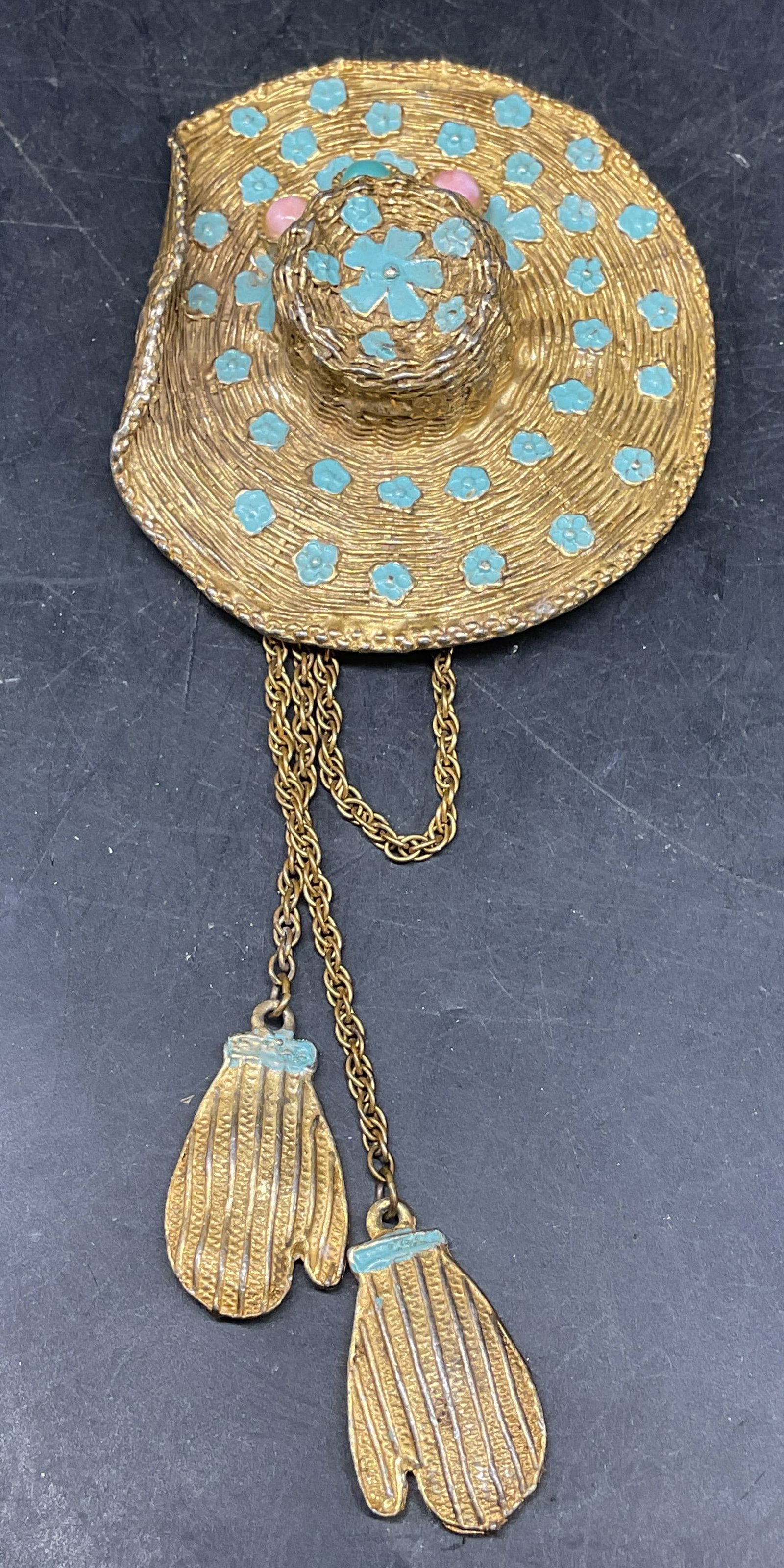 Gold Tone Enamel Hat & Mittens Brooch 5.75 Inches: Vintage gold tone blue enamel hat and mittens motif brooch with pink and blue faux stone cabochons. Measures approx. 5.75 x 2.5 inches. Some scratching. Jewelry, estate jewelry, costume jewelry, cockt