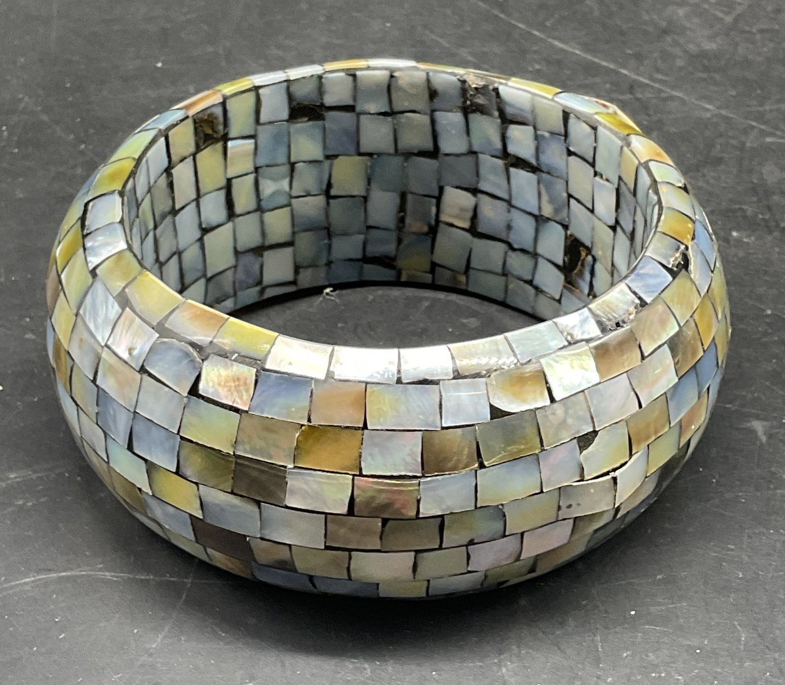 Mother of Pearl Inlay Chunky Bangle Bracelet: Mother of pearl inlaid chunky statement bangle bracelet. Measures approx. 2.75 inches wide. Band approx 1.5 inches wide. Some scratching, chipping. Jewelry, estate jewelry, costume jewelry, cocktail j