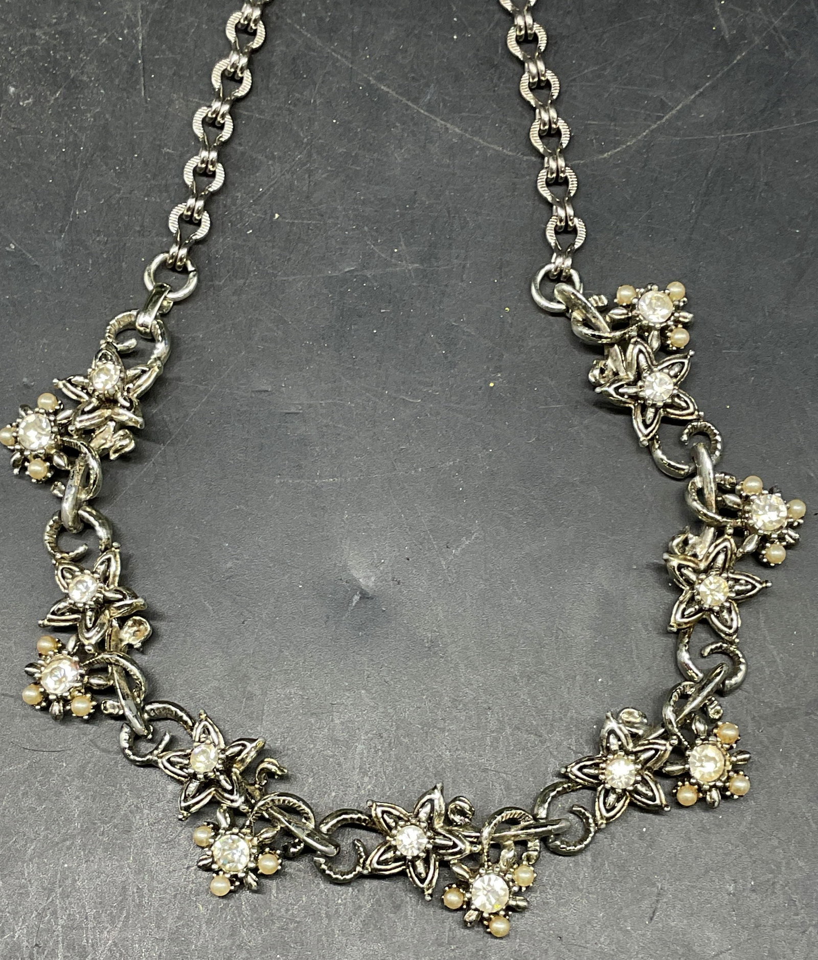 Silver Tone Crystal Faux Pearl Flower Necklace: Vintage silver tone crystal and faux pearl flower necklace. Drop length 7.5 inches. Some scratching. Jewelry, estate jewelry, costume jewelry, cocktail jewelry, fashion jewelry, accessories, fashion