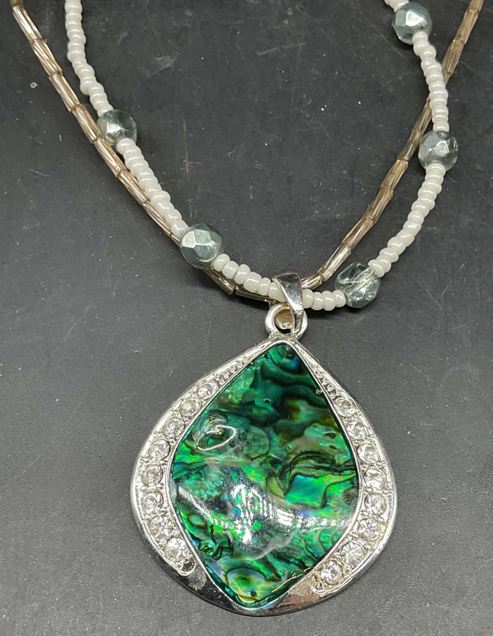 KC Silver Tone Green Crystal Pendant Necklace: Signed KC silver tone green shell style and crystal pendant necklace. Double strand beaded necklace. Drop length 9 inches. Some scratching. Jewelry, estate jewelry, costume jewelry, cocktail jewelry, 