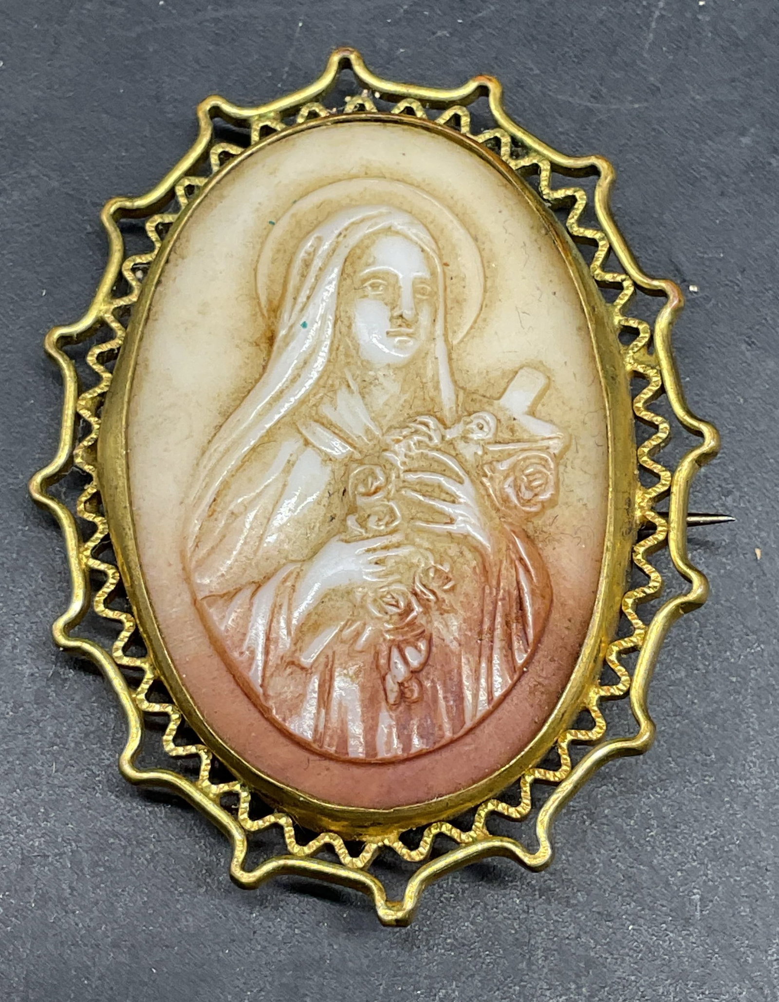 Vintage Gold Tone Virgin Mary Cameo Brooch: Vintage gold tone faux shell lucite Virgin Mary cameo brooch. Measures approx. 1.75 x 1.25 inches. Some scratching. Jewelry, estate jewelry, costume jewelry, cocktail jewelry, fashion jewelry,