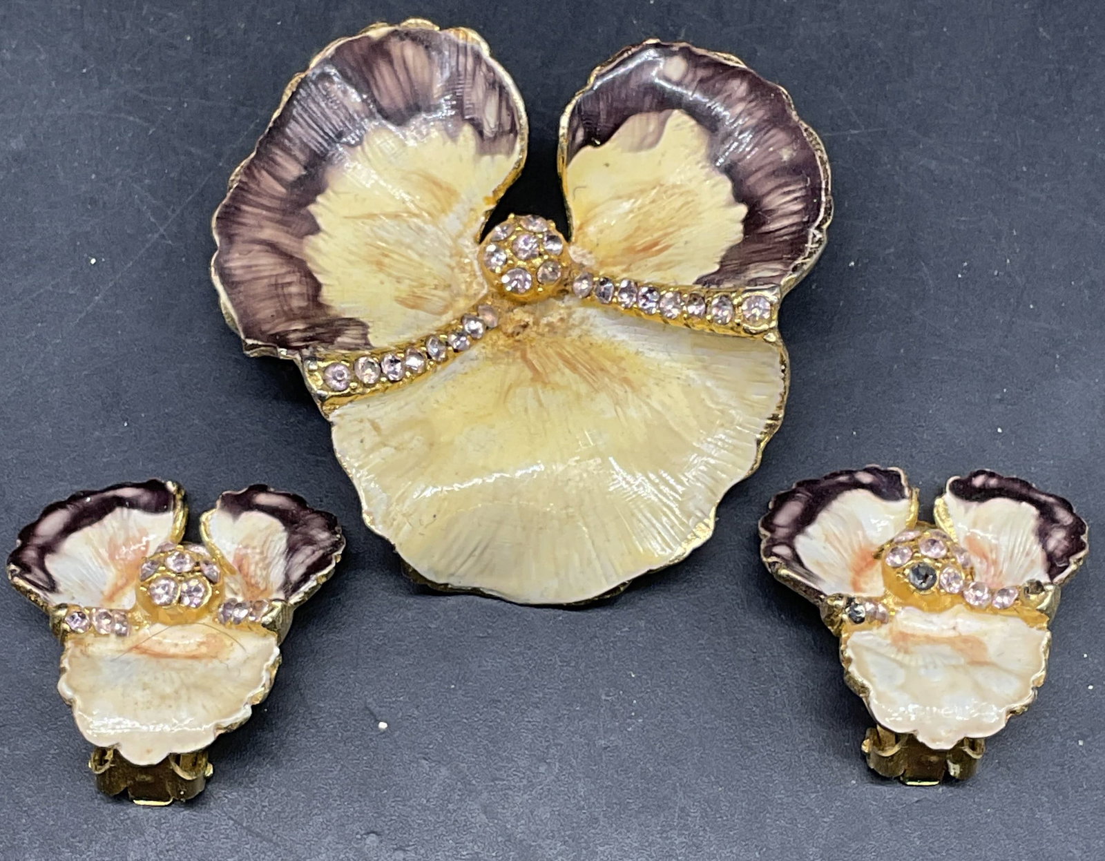Lot 2 Vtg Weiss Orchid Brooch & Earrings: Lot of 2 vintage matching jewelry pieces. Weiss gold tone enamel and crystal orchid flower brooch and earrings. Brooch measures approx. 1.5 x 1.75 inches. Earrings measures approx. .75 x 1 inches.