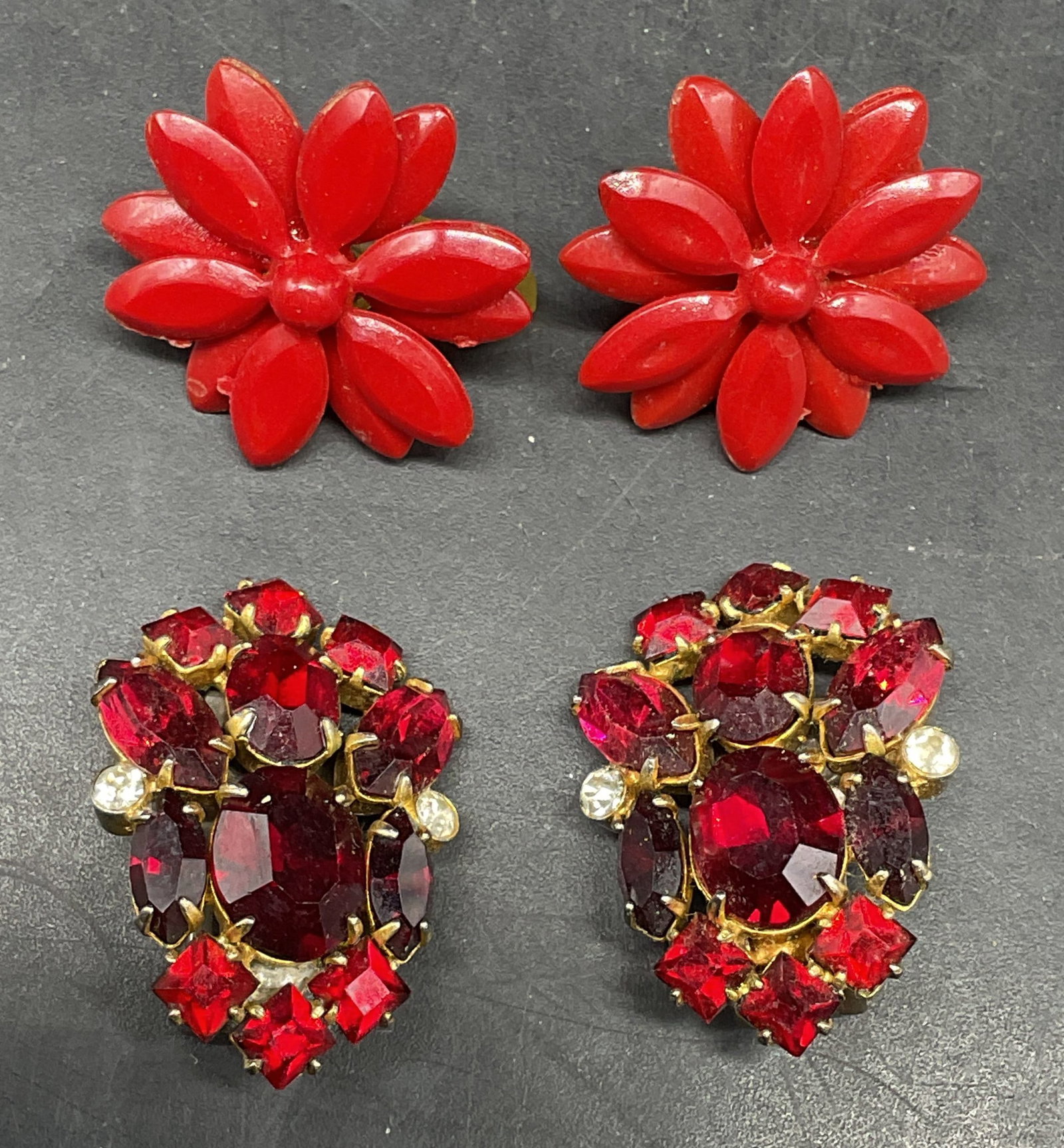 Lot 2 Vtg Red Crystal & Flower Earrings: Lot of 2 pairs of vintage earrings. Red and colorless crystal and red flowers. Larger measures approx. 1 inches long. Some scratching. Jewelry, estate jewelry, costume jewelry, cocktail jewelry,
