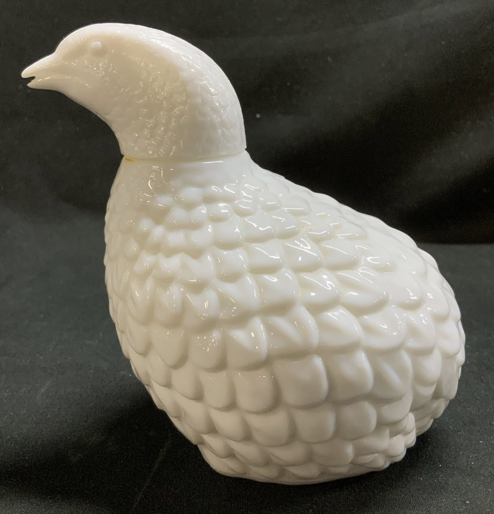 Vtg Avon Partridge Milk Glass Cologne Bottle: Vintage Avon white milk glass cologne bottle shaped as a Partridge bird. Textured feathers. Signed & marked on underside. Reads, AVON. Surface wear consistent to age, use & exposure. Measurements: