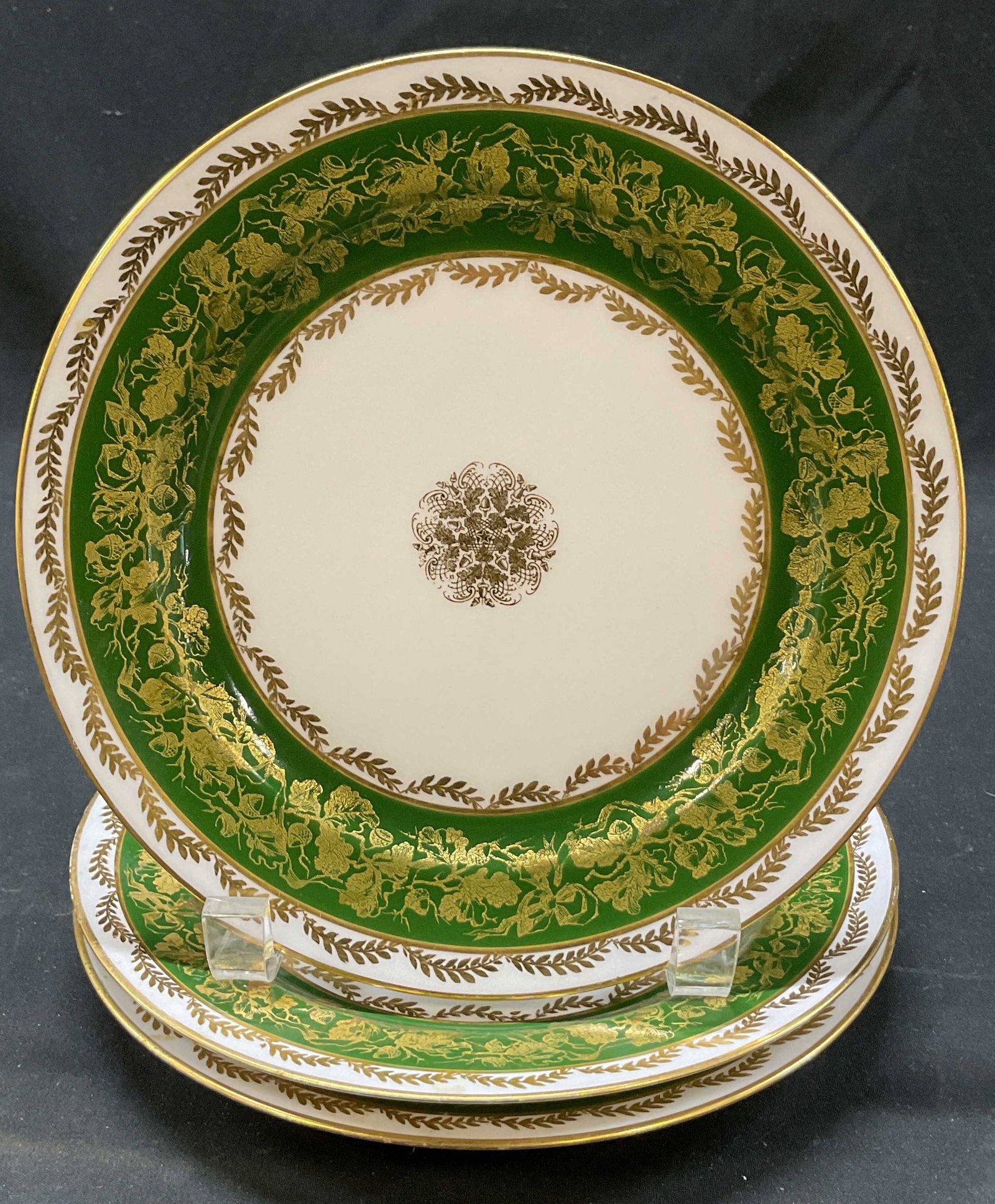 Set 3 J. Pouyat Limoges Porcelain Plates France: Set of 3 J. Pouyat Limoges porcelain plates. Marked on underside as photographed here. Round plates with gilt edge. Acorn, leaf, and scroll motifs in gilt and green. Central floral medallion.