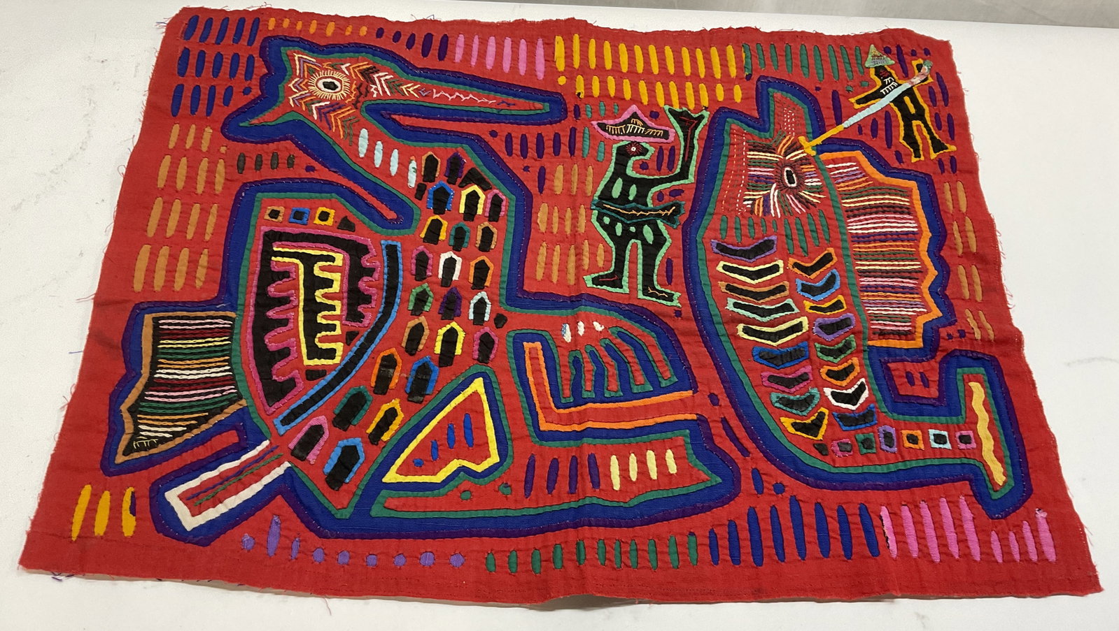1970 Guna Mola Bird&Fish Textile PANAMA: Vintage Hand-Stitched Guna Textile. Vibrant Striped Borders. Made Using a Reverse Applique Method in Panama. Panama Expedition 1970 Tag on Back. Features Stylized Bird, Fish, and Figure Motifs. Condit
