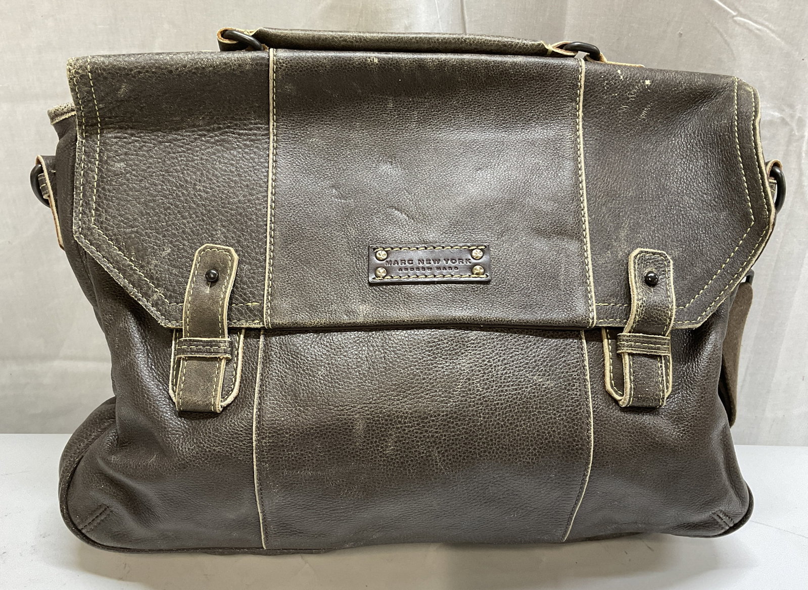 Marc New York Andrew Marc Full Grain Leather Bag: Marc New York by Andrew Marc Textured Brown 100% Full Grain Leather Messenger Bag with Contrasting Stitching. Scuffing and Fading Present. Measures app 14.75in H x 16.5in L. Marc New York, Andrew