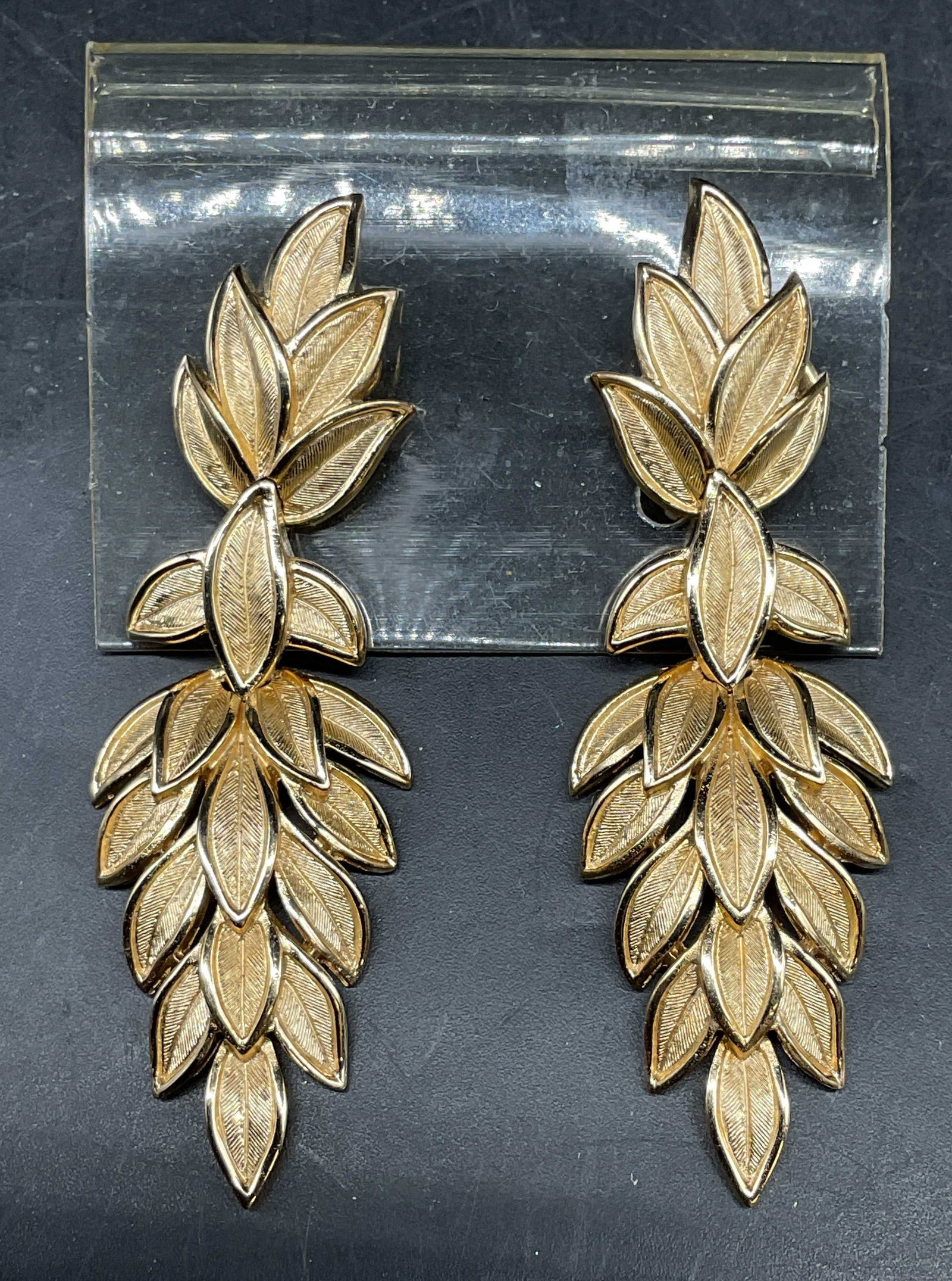 Vintage Trifari Gold Tone Leaf Earrings: Vintage Trifari gold tone leaf motif dangle earrings. Measures approx. 2.5 inches long. Some scratching. Jewelry, estate jewelry, costume jewelry, cocktail jewelry, fashion jewelry, accessories,