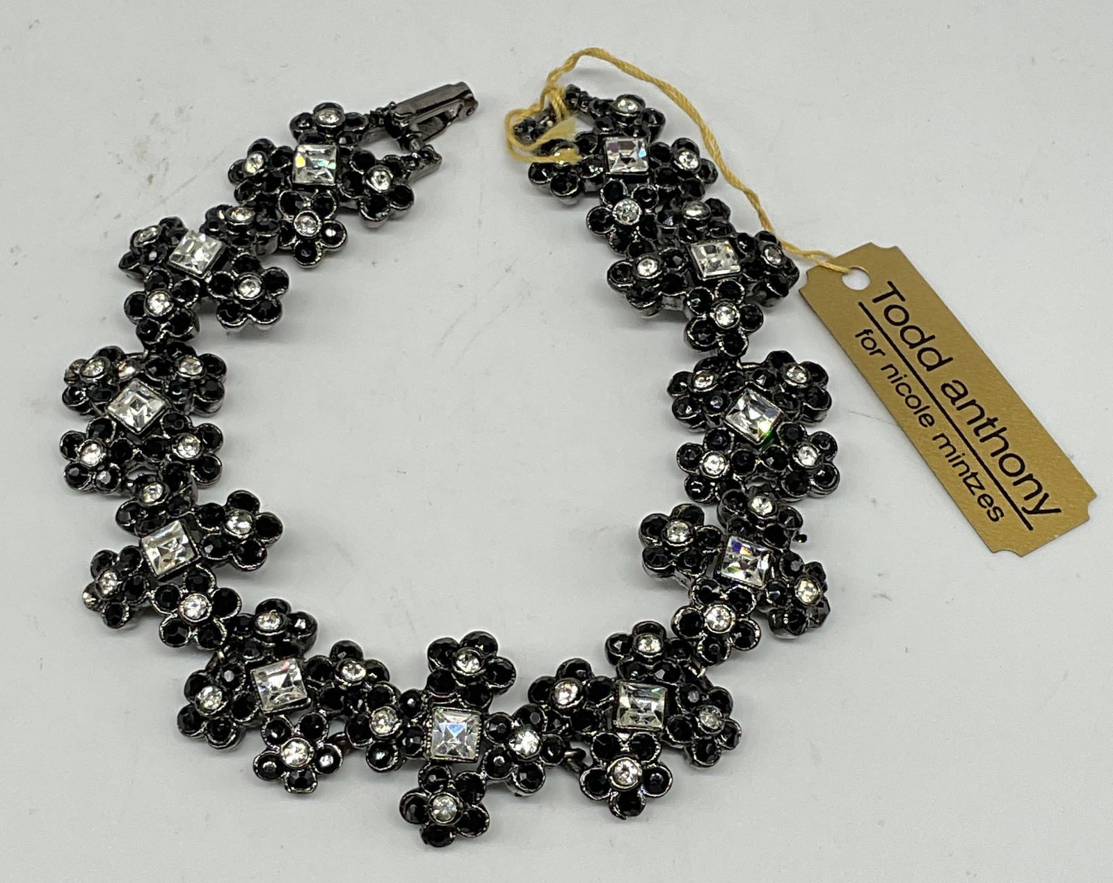 Vtg Todd Anthony Nicole Mintzes Crystal Bracelet: Vintage Todd Anthony for Nicole Mintzes black and colorless crystal flower panel bracelet. Measures approx. 7.75 inches. New with tag. Some scratching. Jewelry, estate jewelry, costume jewelry,