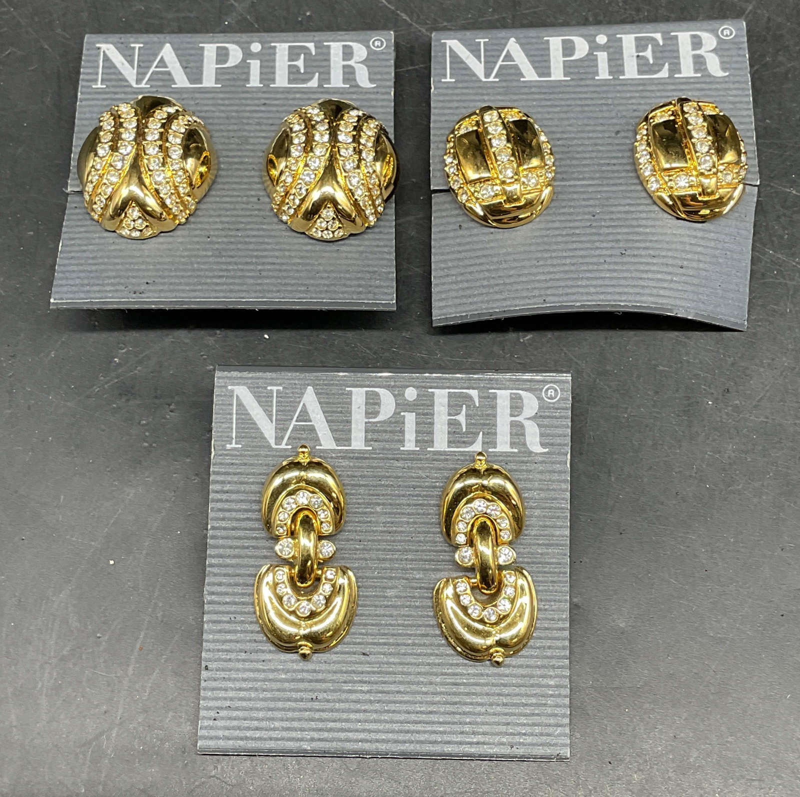 Lot 3 Napier Gold Tone Crystal Earrings NWT: Lot of 3 pairs of vintage Napier gold tone and colorless crystal earrings. New with tags. Largest measures approx. 1.25 inches long. Some scratching. Jewelry, estate jewelry, costume jewelry,