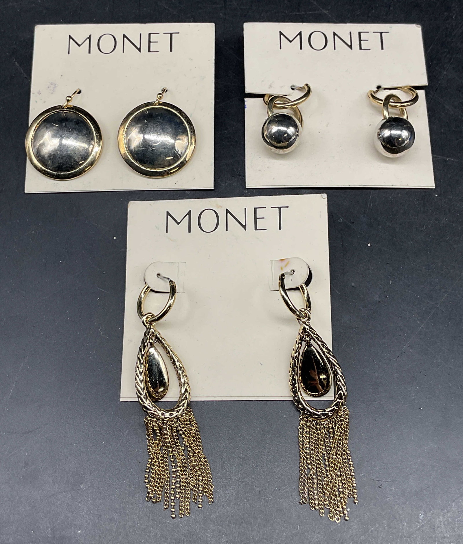 Lot 3 Vintage Monet Gold Tone Earrings NWT: Lot of 3 pairs of vintage Monet silver and gold tone dangle earrings. New with tags. Largest measures approx. 2.5 inches long. Some scratching. Jewelry, estate jewelry, costume jewelry, cocktail jewel