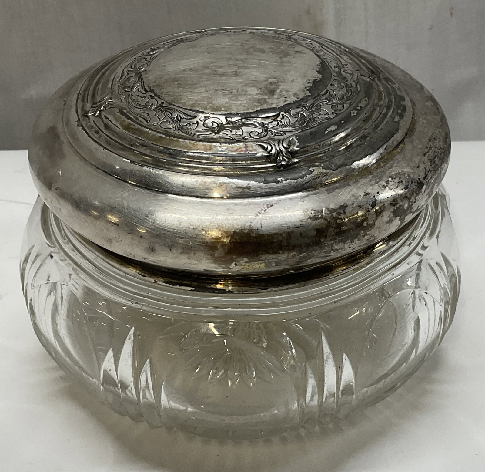 ANTIQUE Silver-Plate Lidded Cut Glass Jar: Antique Cut Glass Vanity Dresser Jar with Silver-Plated Lid. Scratching and Tarnishing Present. Measures app 3.5in H x 4.5in Diam. Antique, Cut Glass, Glass Jar, Vanity Accessories, Dresser Jar,
