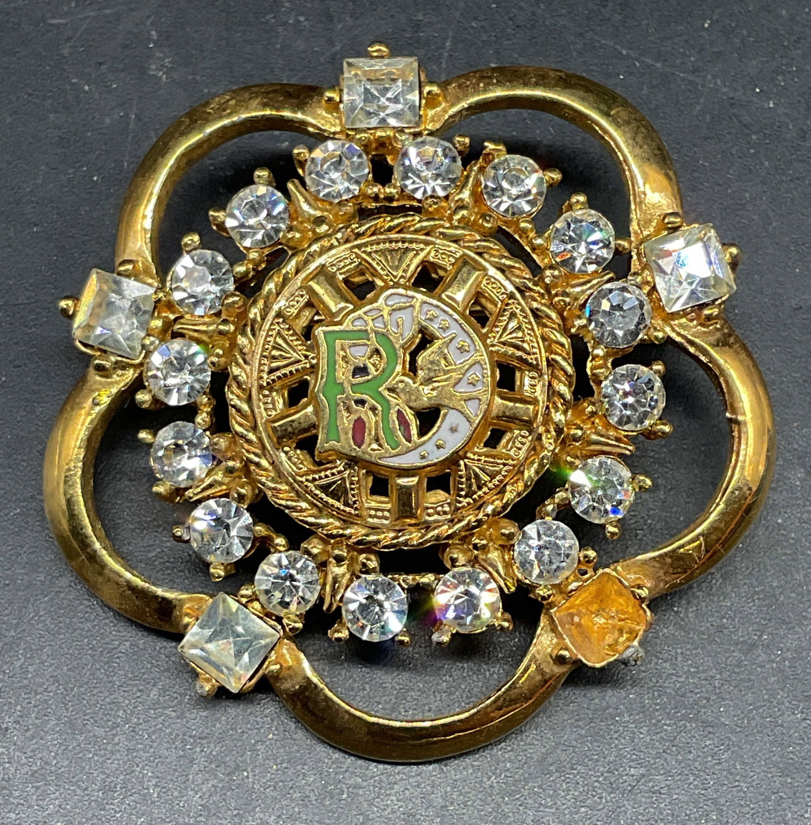 Daughters of Rebekah Floral Crystal Brooch: Vintage gold tone Daughters of Rebekah Oddfellows brooch with enamel and Crystal decoration. Measures approx. 1.5 inches wide. Some scratching. One crystal needs replacement. Jewelry, estate jewelry, 