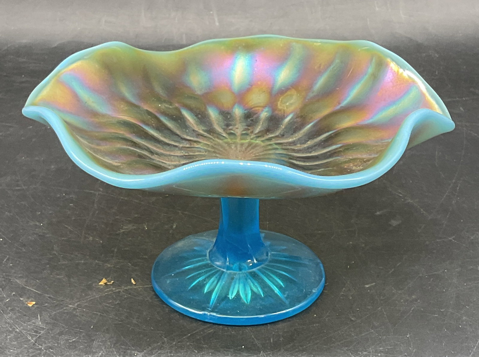 Vintage Opaline Carnival Glass Footed Compote: Vintage blue Opaline carnival glass footed compote with ruffled rim. Measures approx. 6.5 x 3.5 inches. Some scratching and small chips on base. Opaline glass compote, carnival glass compote,