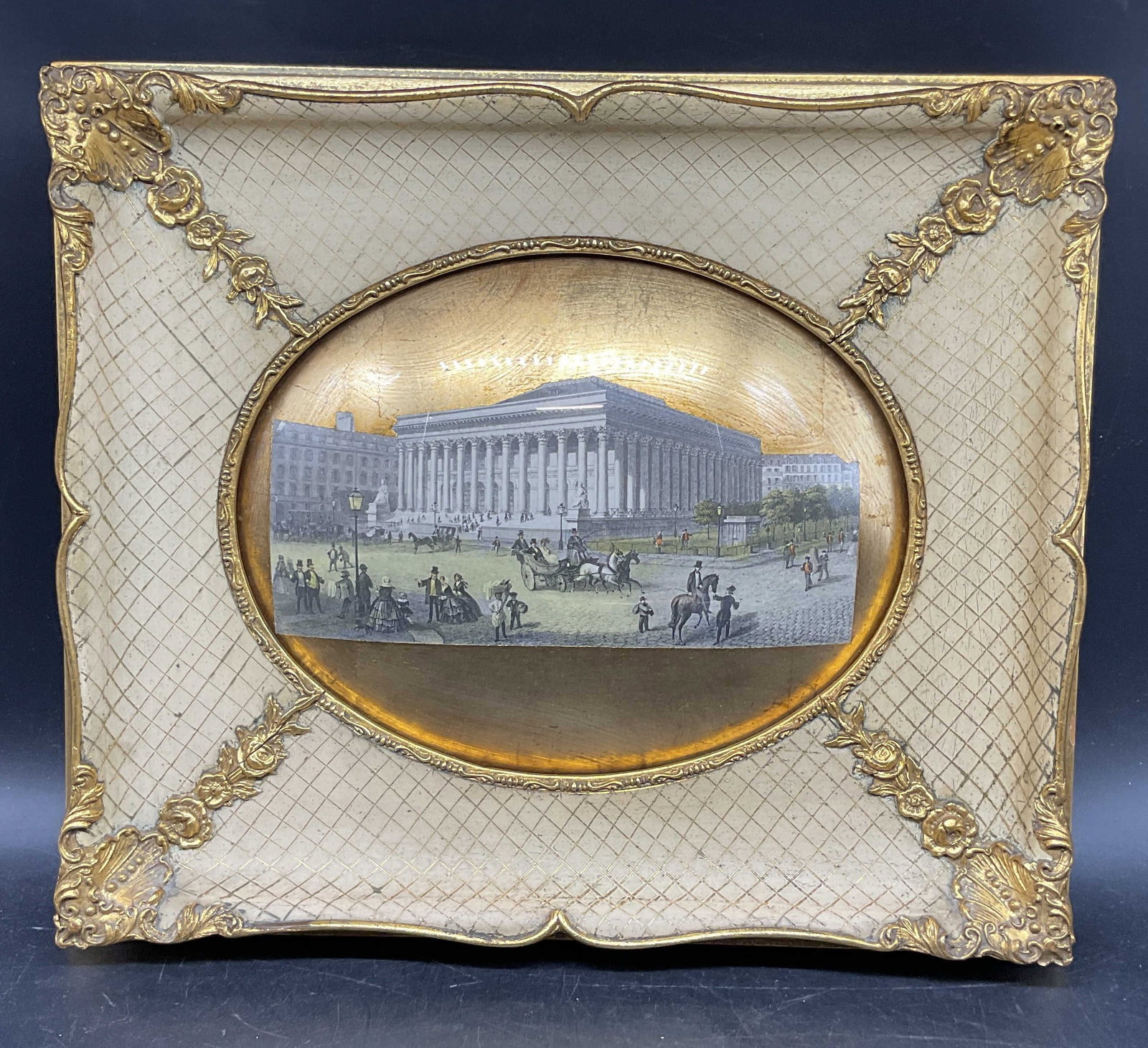 Ornate Gilt Framed Paris Bourse Lithograph: Framed lithograph. Paris Bourse. Stock exchange. Cut and pasted with gold leaf under convex glass. Ornate gilt and white painted wood frame. Not examined out of frame. Frame measures approx. 12.5 x