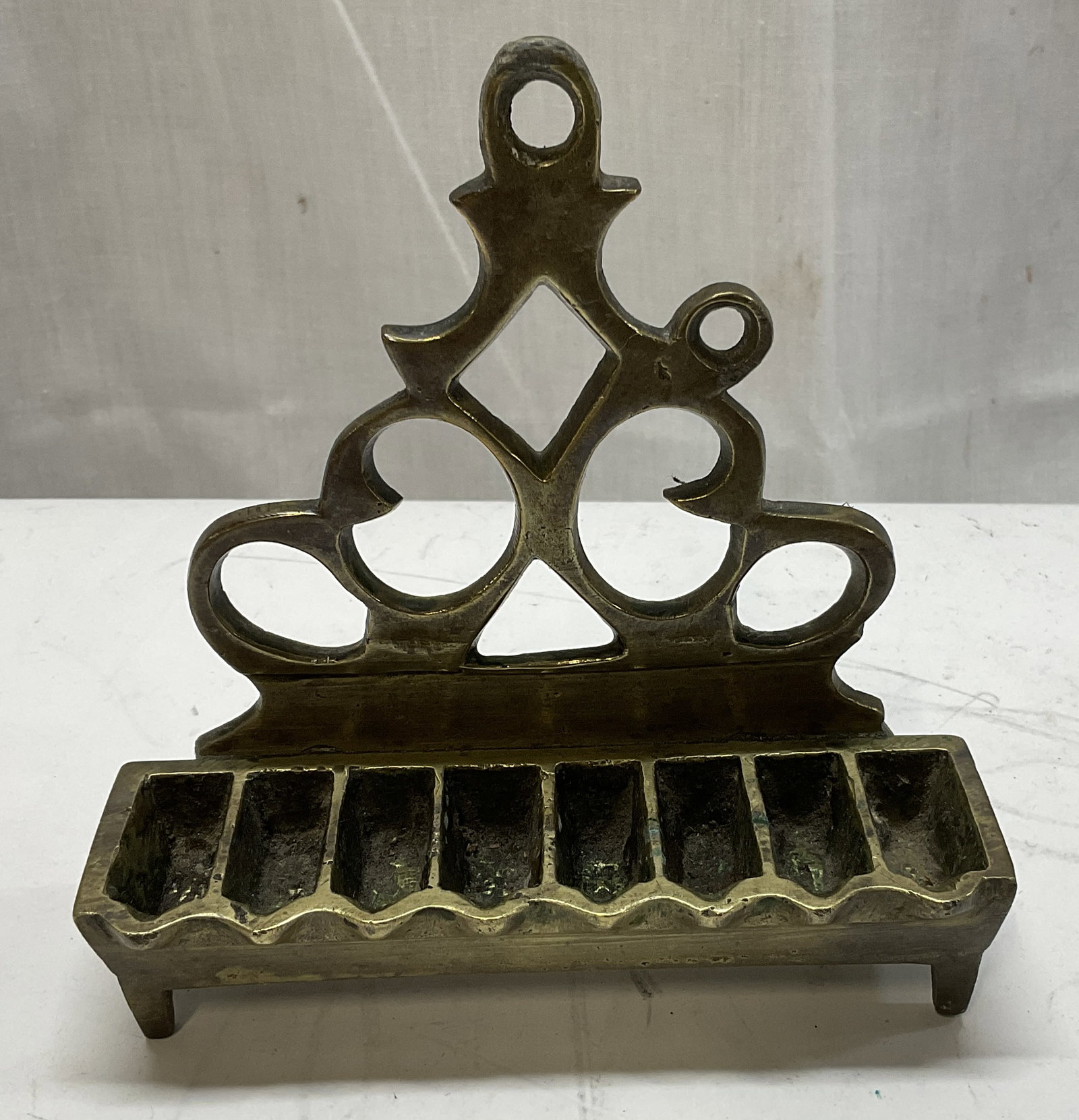 ANTQ Brass Hanukkah Oil Lamp Menorah: Antique Brass Hanukkah Oil Lamp Menorah. Features 8 Oil Fonts. Openwork Scroll Silhouette. Tarnish and Residue Present. Measures app 5in H x 4.75in L. Antiques, Brass, Hanukkah, Holiday Decor, Event