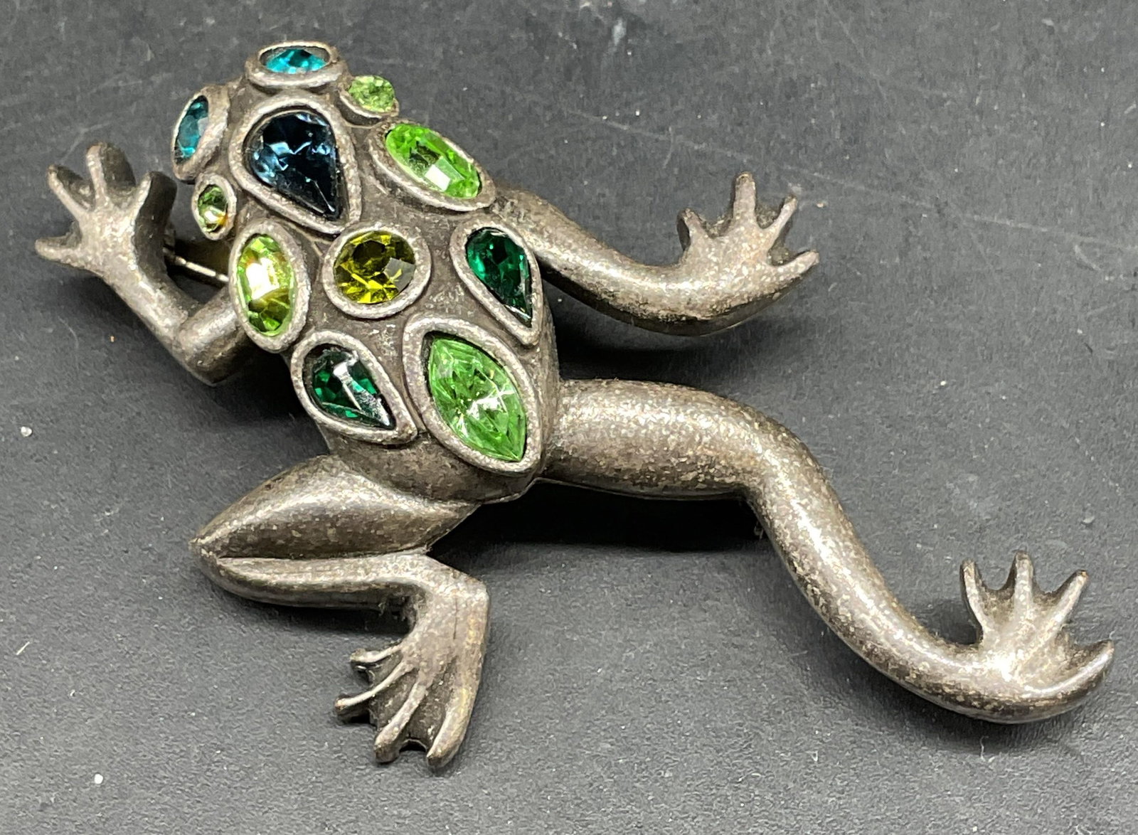Chicos Silver Tone Green Crystal Frog Brooch: Chicos silver tone green and blue crystal frog brooch. Measures approx. 2.25 x 1.75 inches. Some scratching. Jewelry, estate jewelry, costume jewelry, cocktail jewelry, fashion jewelry, accessories, f