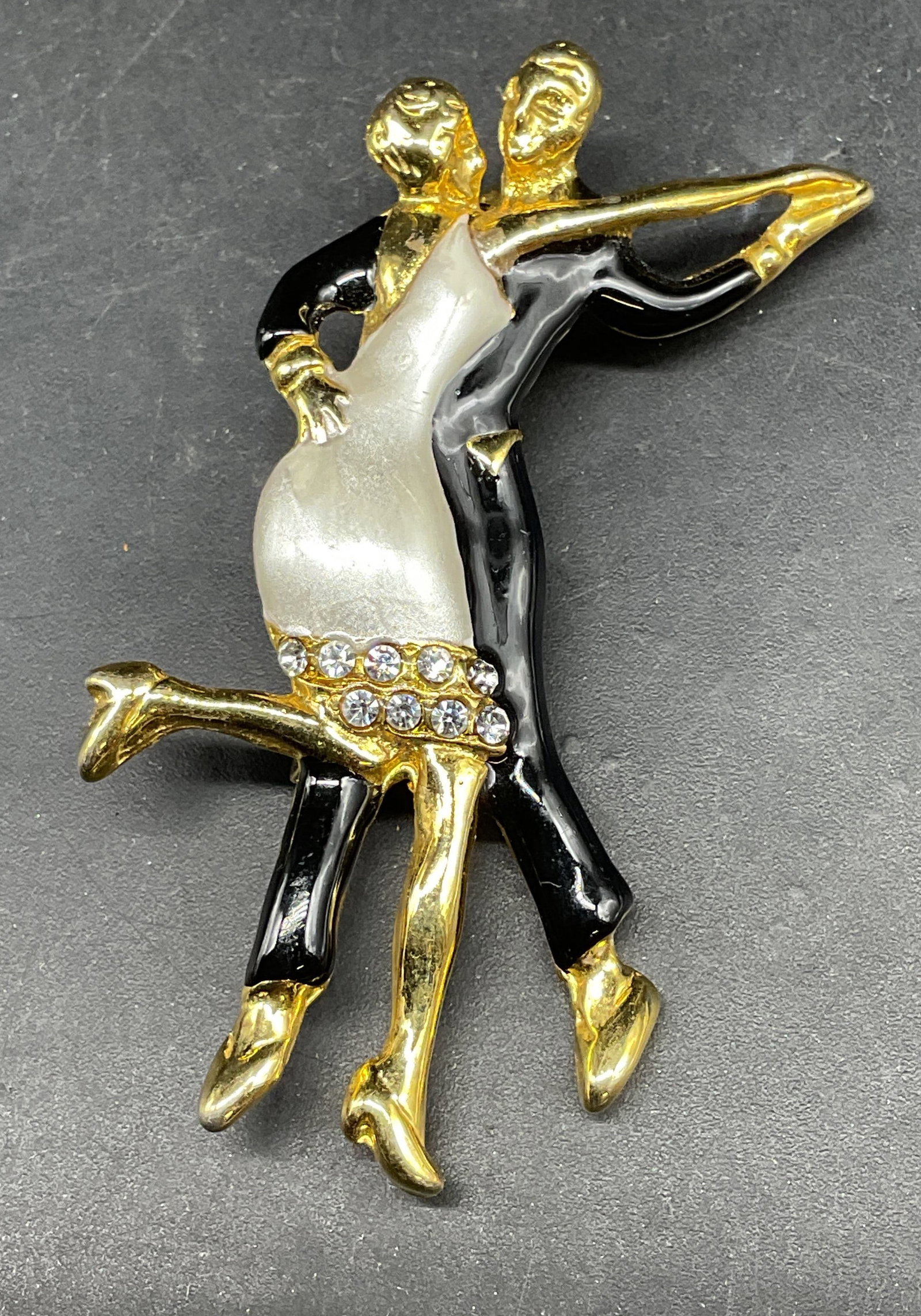 Gold Tone Enamel Dancing Couple Brooch: Gold tone enamel and crystal dancing couple brooch. Measures approx. 2.25 x 1.25 inches. Some scratching. Jewelry, estate jewelry, costume jewelry, cocktail jewelry, fashion jewelry, accessories, fash