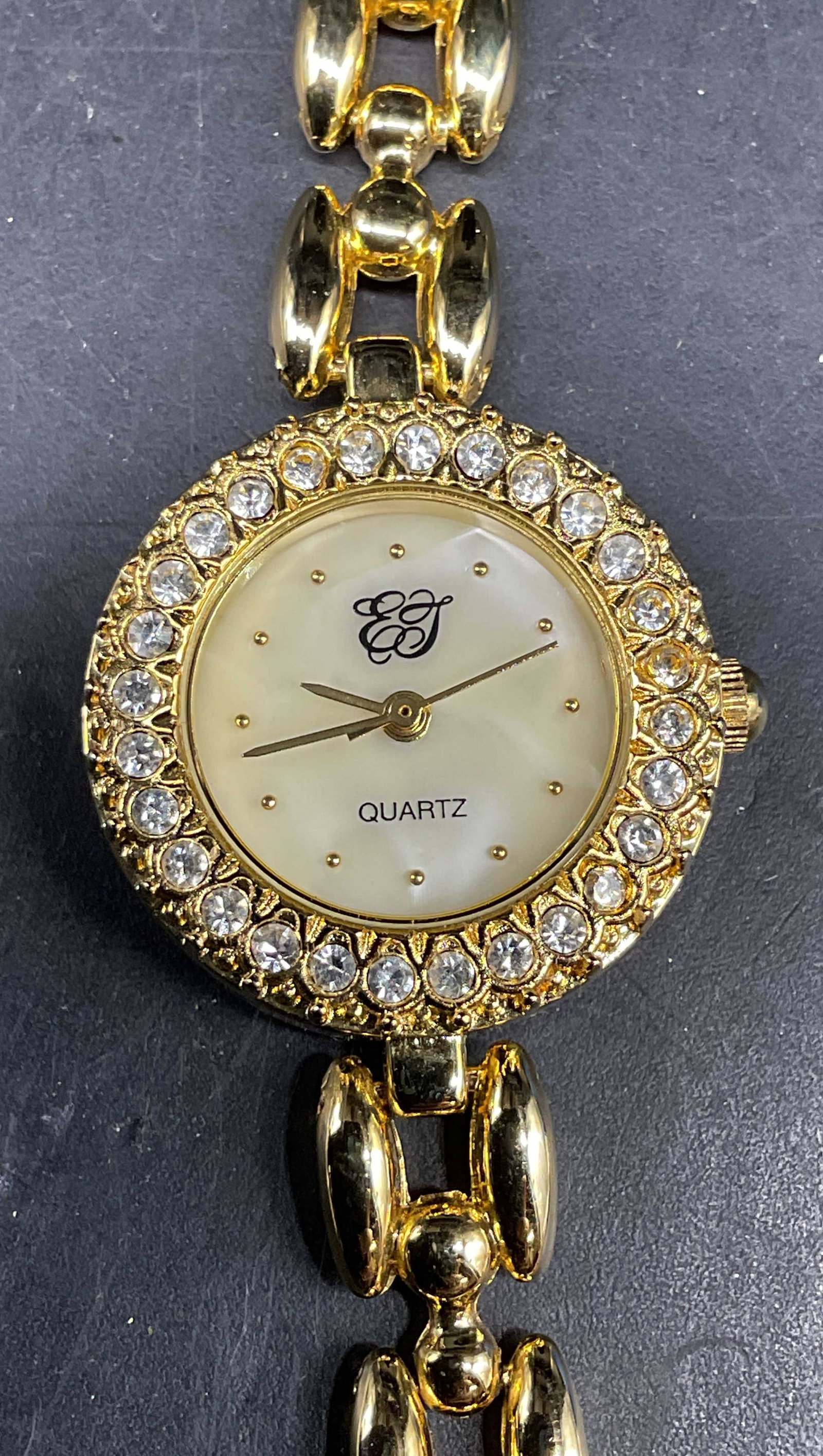 Elizabeth Taylor Gold Tone Crystal Watch: Elizabeth Taylor White Diamonds gold tone and crystal chain link watch. Measures approx. 7.25 inches. Not tested. Some scratching. Jewelry, estate jewelry, costume jewelry, cocktail jewelry, fashion j