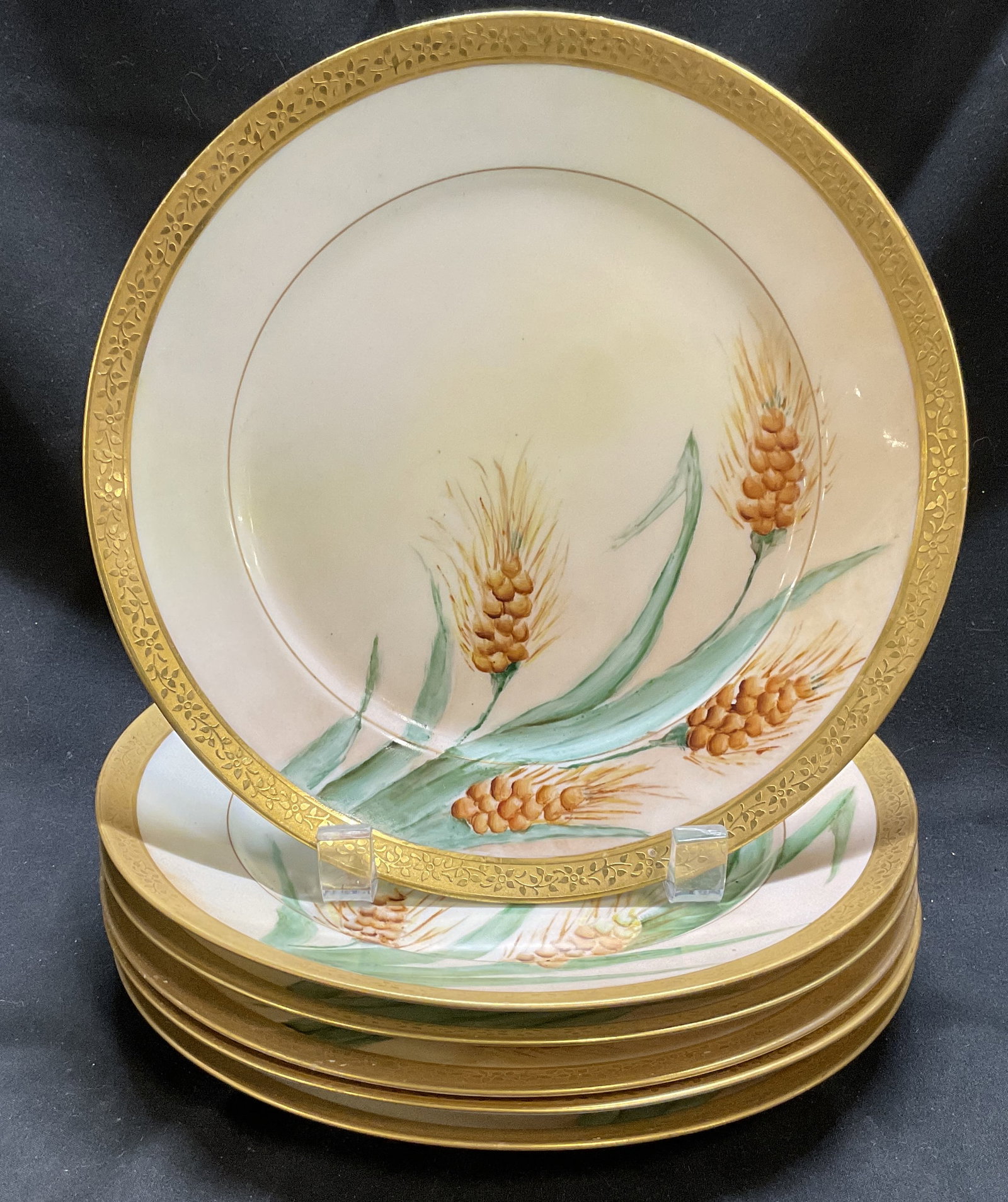ANTQ SGND GDA FRANCE Wheat Design Plates: Antique Signed GDA France Wheat Design Porcelain Plates. Gilt Border. Signature on Some Marked as Photographed. Fading, Chips, and Residue Present. Measures app 1in H x 8.5in Diam. Antique Plates,