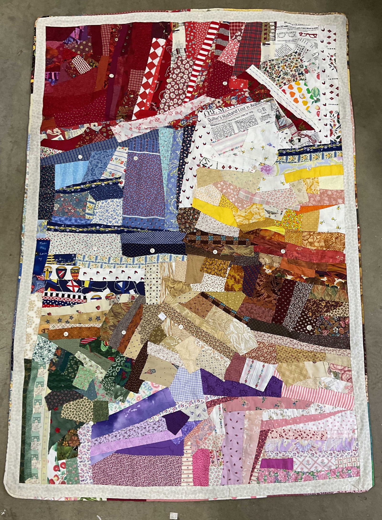 Vintage Hand Pieced Patchwork Cotton Quilt: Vintage hand pieces cotton quilt. Abstract design with graphic print patches and hand sewn buttons. Measures approx. 57 x 39 inches. Some wear consistent with exposure. Quilt, handmade quilt, vintage