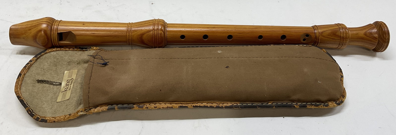 VTG Kung Wooden Recorder in Pouch SWITZ: Vintage Kung Wooden Recorder. Made in Switzerland. Comes in Original Brown Canvas Pouch with Patterned Crocodile Leather Style Trim. Brown Fuzzy Interior. Fraying to Trim. Some Scratching. Recorder